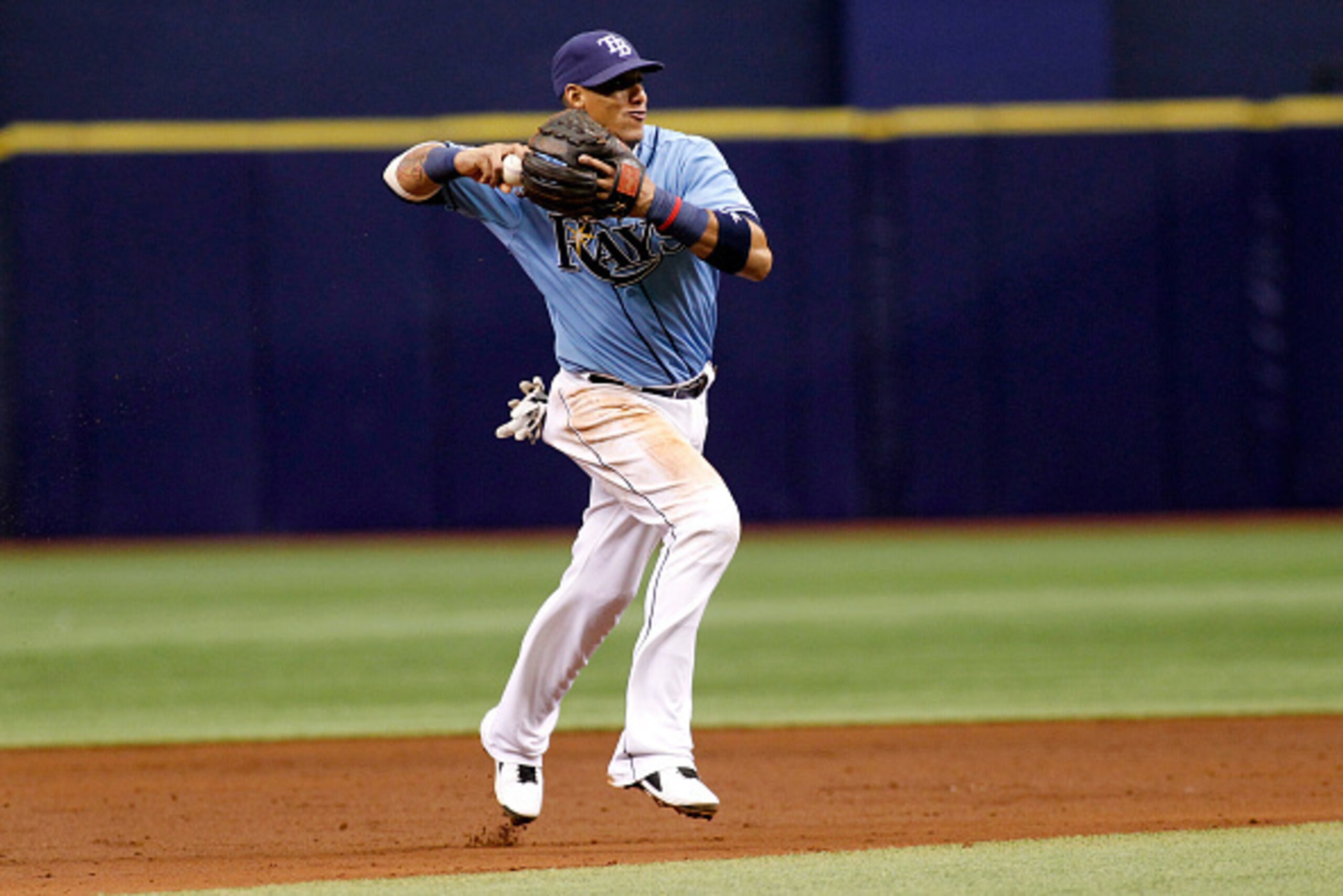 ST. PETERSBURG, FL - SEPTEMBER 21:  Shortstop Yunel Escobar #11 of the Tampa Bay Rays fields the ground out by Carlos Sanchez of the Chicago White Sox during the third inning of a game on September 21, 2014 at Tropicana Field in St. Petersburg, Florida.  
