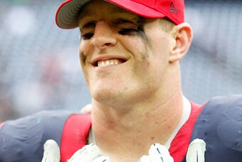 HOUSTON, TX - NOVEMBER 30: J.J. Watt #99 of the Houston Texans smiles after defeating the Tennessee Titans in the  in a NFL game on November 30, 2014 at NRG Stadium in Houston, Texas. (Photo by Bob Levey/Getty Images)