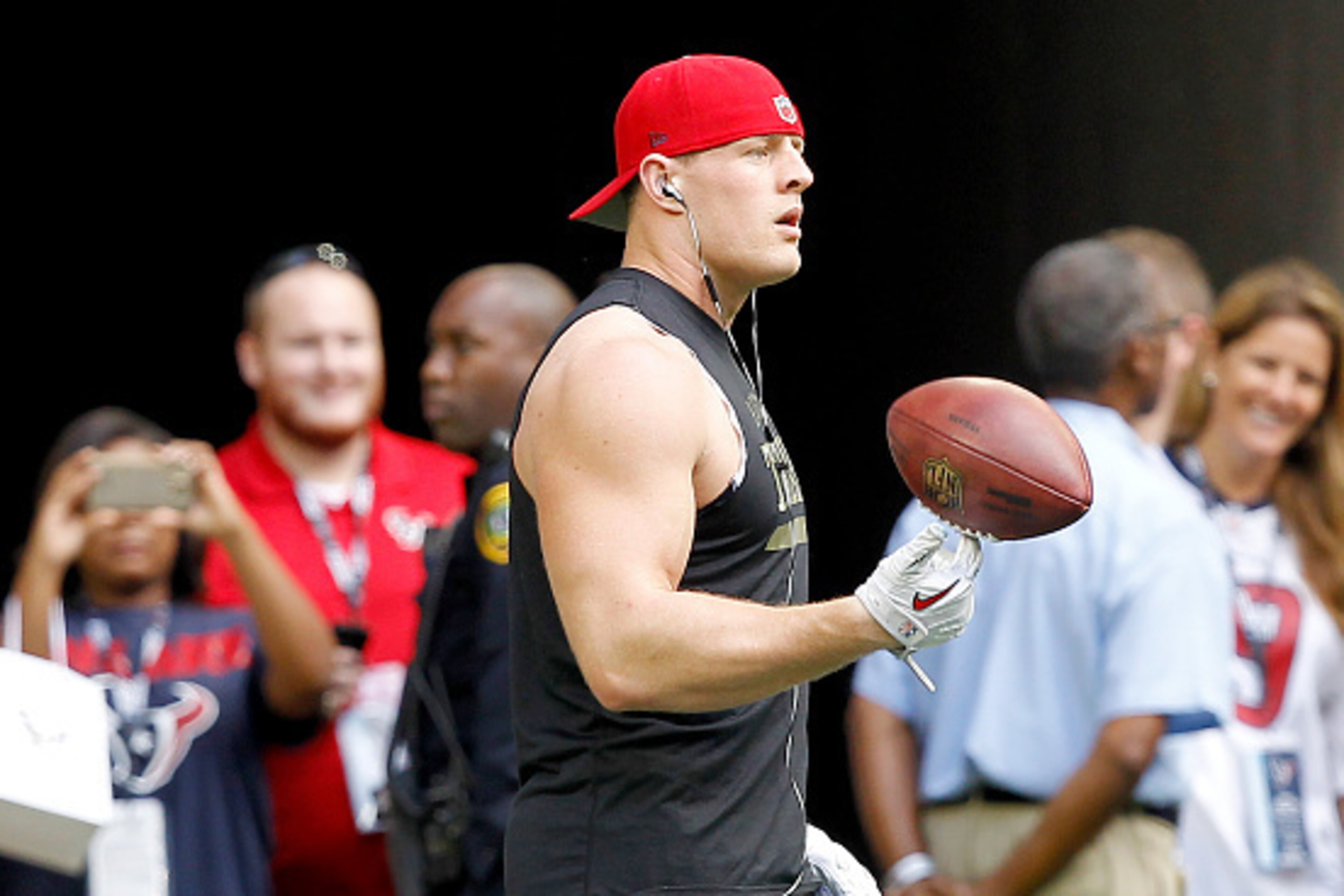 HOUSTON, TX - NOVEMBER 30: J.J. Watt #99 of the Houston Texans warms up before playing the Tennessee Titans in a NFL game on November 30, 2014 at NRG Stadium in Houston, Texas. (Photo by Bob Levey/Getty Images) HOUSTON, TX - NOVEMBER 30: J.J. Watt #99 of the Houston Texans warms up before playing the Tennessee Titans in a NFL game on November 30, 2014 at NRG Stadium in Houston, Texas. (Photo by Bob Levey/Getty Images)
