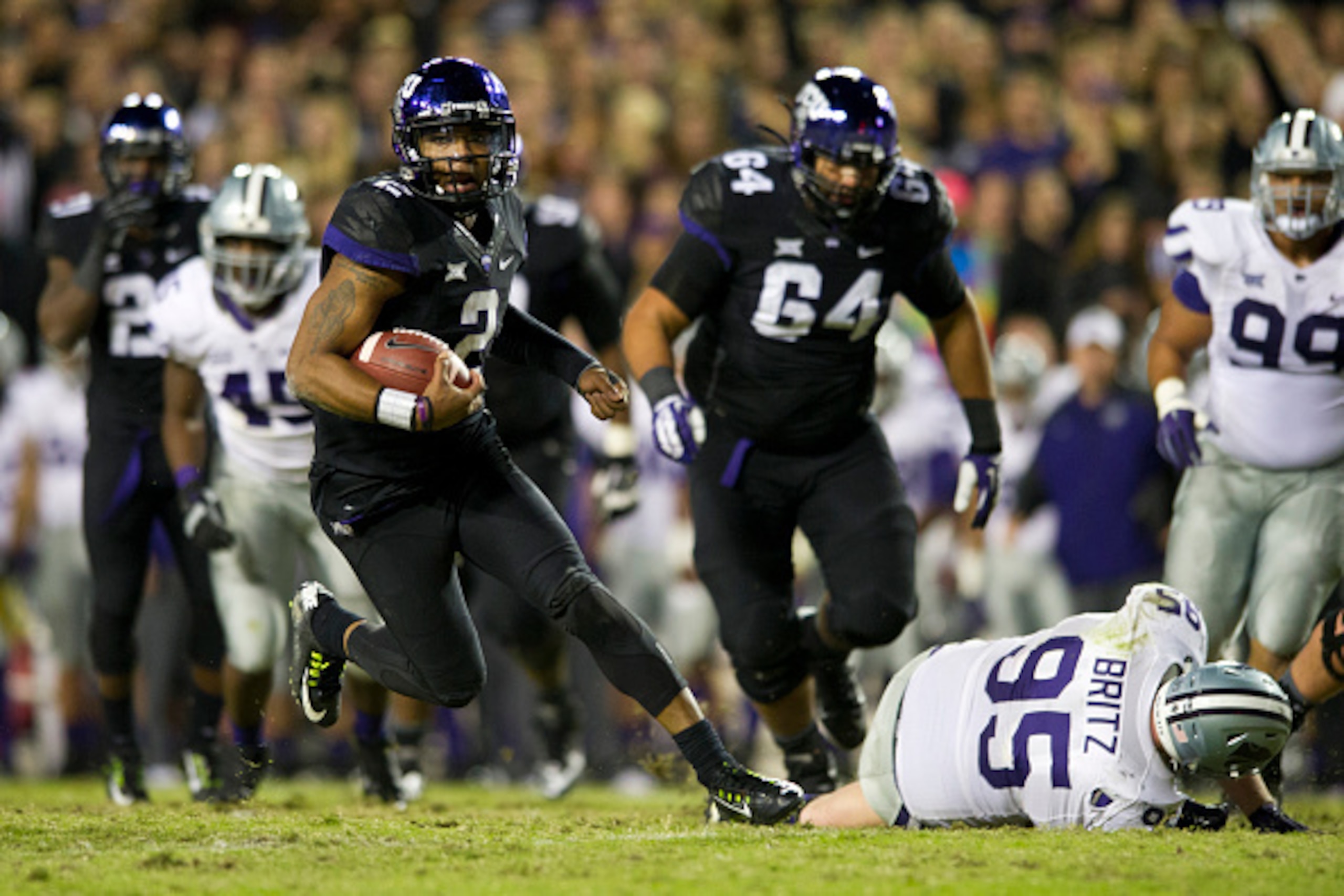 FORT WORTH, TX - NOVEMBER 8:  Trevone Boykin #2 of the TCU Horned Frogs breaks free against the Kansas State Wildcats during the 4th quarter on November 8, 2014 at Amon G. Carter Stadium in Fort Worth, Texas.  (Photo by Cooper Neill/Getty Images)