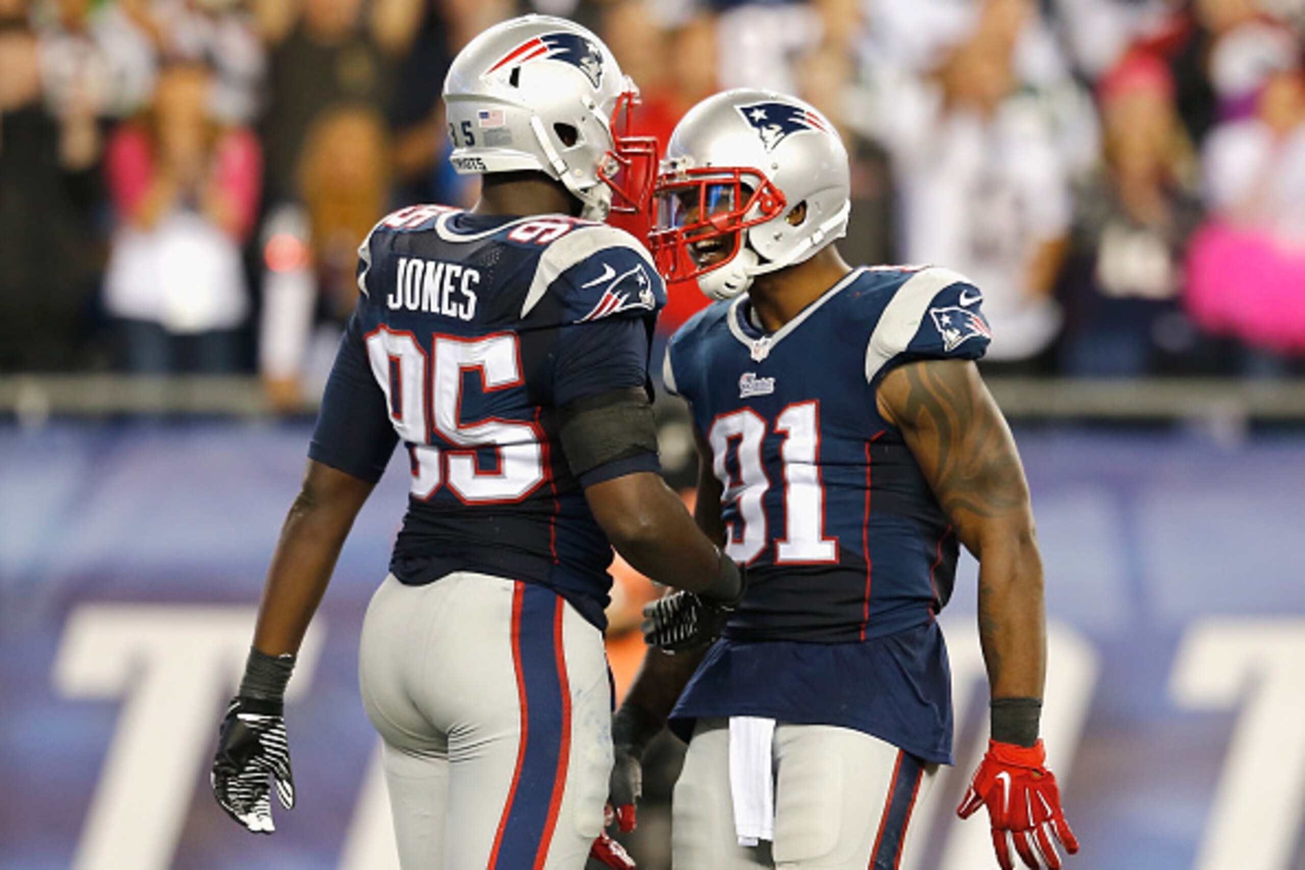 FOXBORO, MA - OCTOBER 16: Chandler Jones #95 and Tim Wright #81 of the New England Patriots react during the fourth quarter against the New York Jets at Gillette Stadium on October 16, 2014 in Foxboro, Massachusetts. (Photo by Jim Rogash/Getty Images) FOXBORO, MA - OCTOBER 16: Chandler Jones #95 and Tim Wright #81 of the New England Patriots react during the fourth quarter against the New York Jets at Gillette Stadium on October 16, 2014 in Foxboro, Massachusetts. (Photo by Jim Rogash/Getty Images)