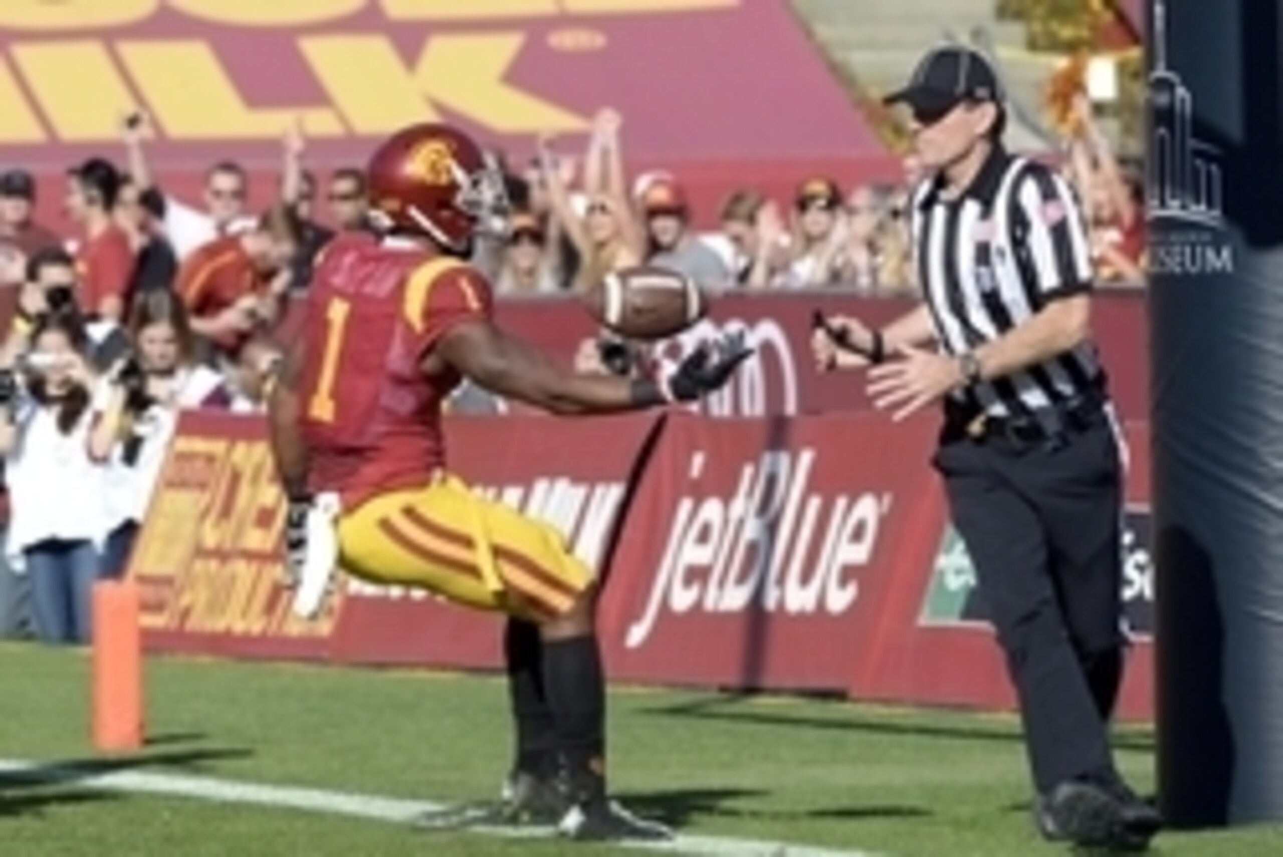 Nov 29, 2014; Los Angeles, CA, USA; Southern California Trojans wide receiver Darreus Rogers (1) hands the ball to an official after a touchdown against the Notre Dame Fighting Irish during the first half at Los Angeles Memorial Coliseum. Mandatory Credit