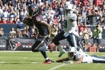 Nov 30, 2014; Houston, TX, USA; Houston Texans receiver DeAndre Hopkins (10) runs after a reception for a second quarter touchdown against the Tennessee Titans at NRG Stadium. Mandatory Credit: Matthew Emmons-USA TODAY Sports