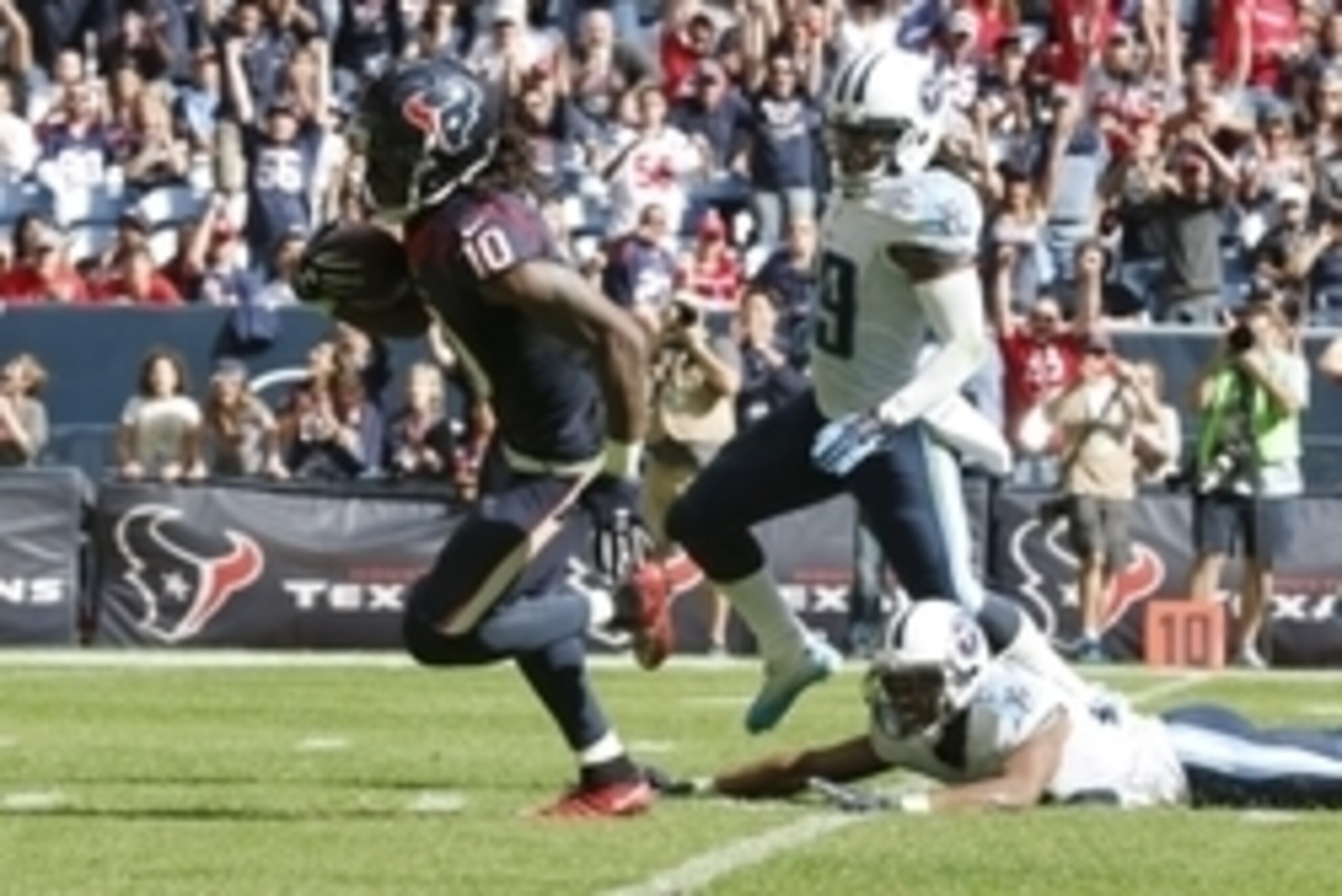 Nov 30, 2014; Houston, TX, USA; Houston Texans receiver DeAndre Hopkins (10) runs after a reception for a second quarter touchdown against the Tennessee Titans at NRG Stadium. Mandatory Credit: Matthew Emmons-USA TODAY Sports