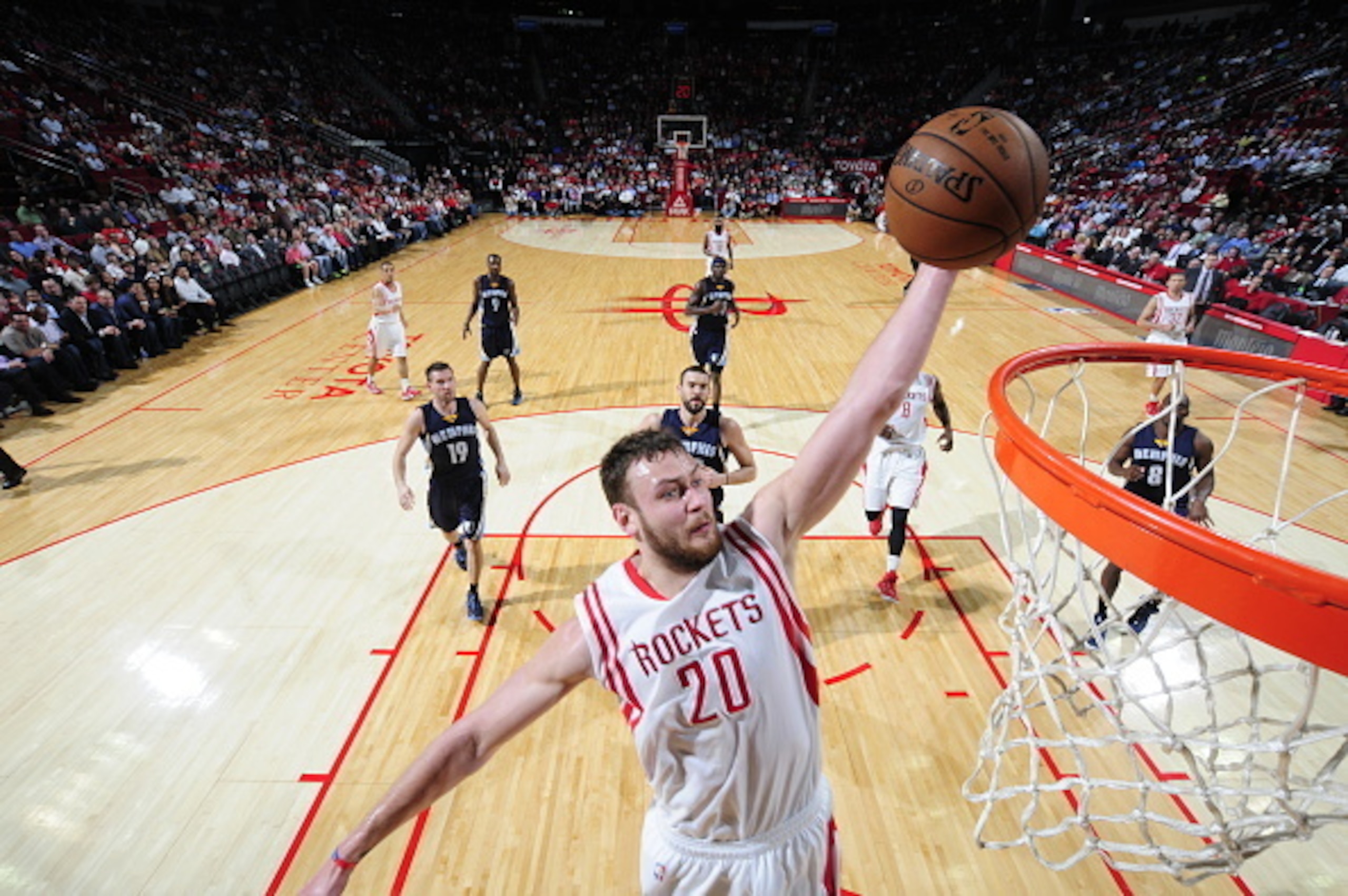 HOUSTON, TX -  DECEMBER 3: Donatas Motiejunas #20 of the Houston Rockets goes up for a dunk against the Memphis Grizzlies on December 3, 2014 at Toyota Center in Houston, Texas. NOTE TO USER: User expressly acknowledges and agrees that, by downloading and