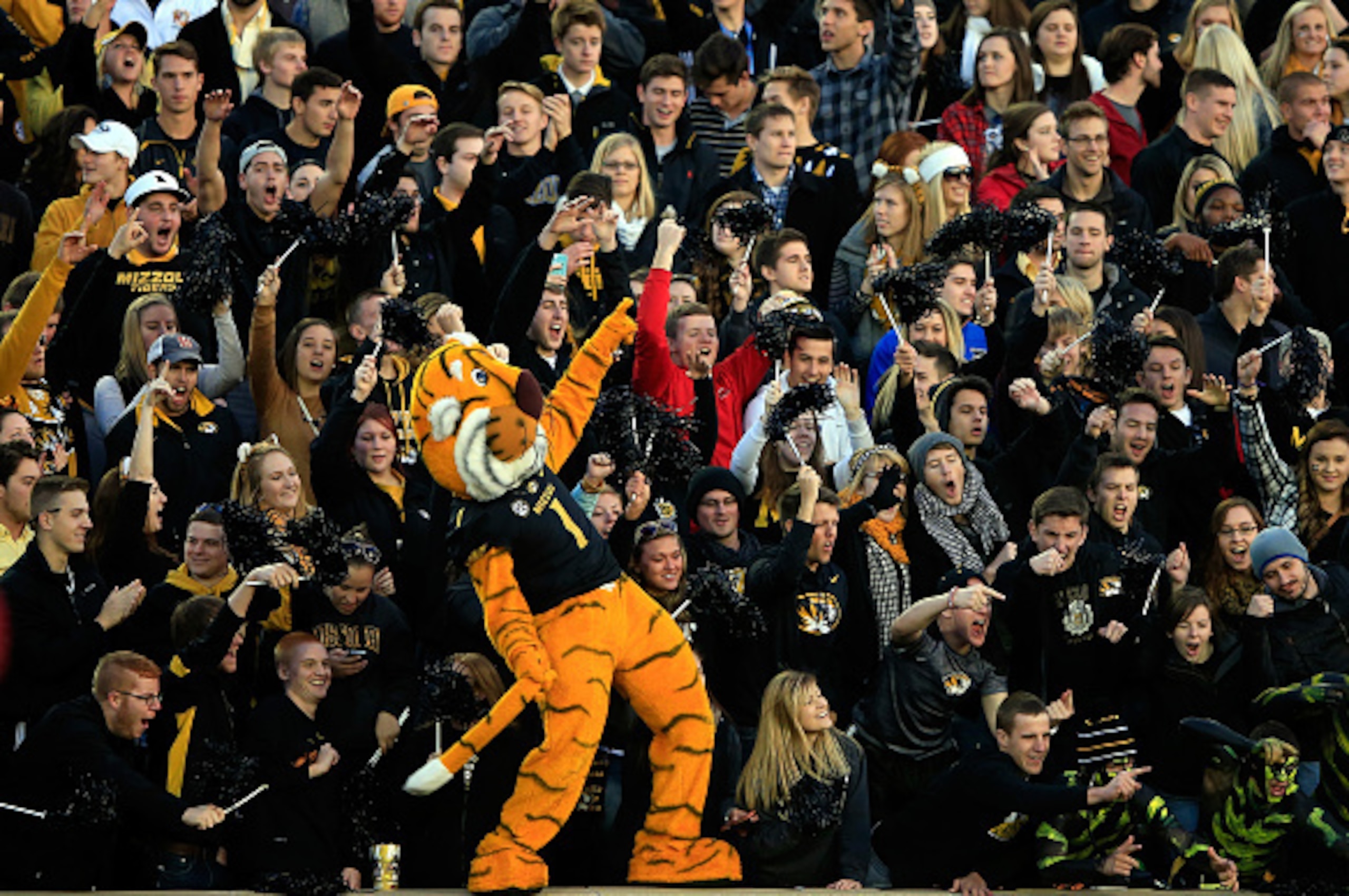 COLUMBIA, MO - NOVEMBER 28:  The Missouri Tigers mascot, Truman, cheers with fans during the game against the Arkansas Razorbacks at Faurot Field/Memorial Stadium on November 28, 2014 in Columbia, Missouri.  (Photo by Jamie Squire/Getty Images)