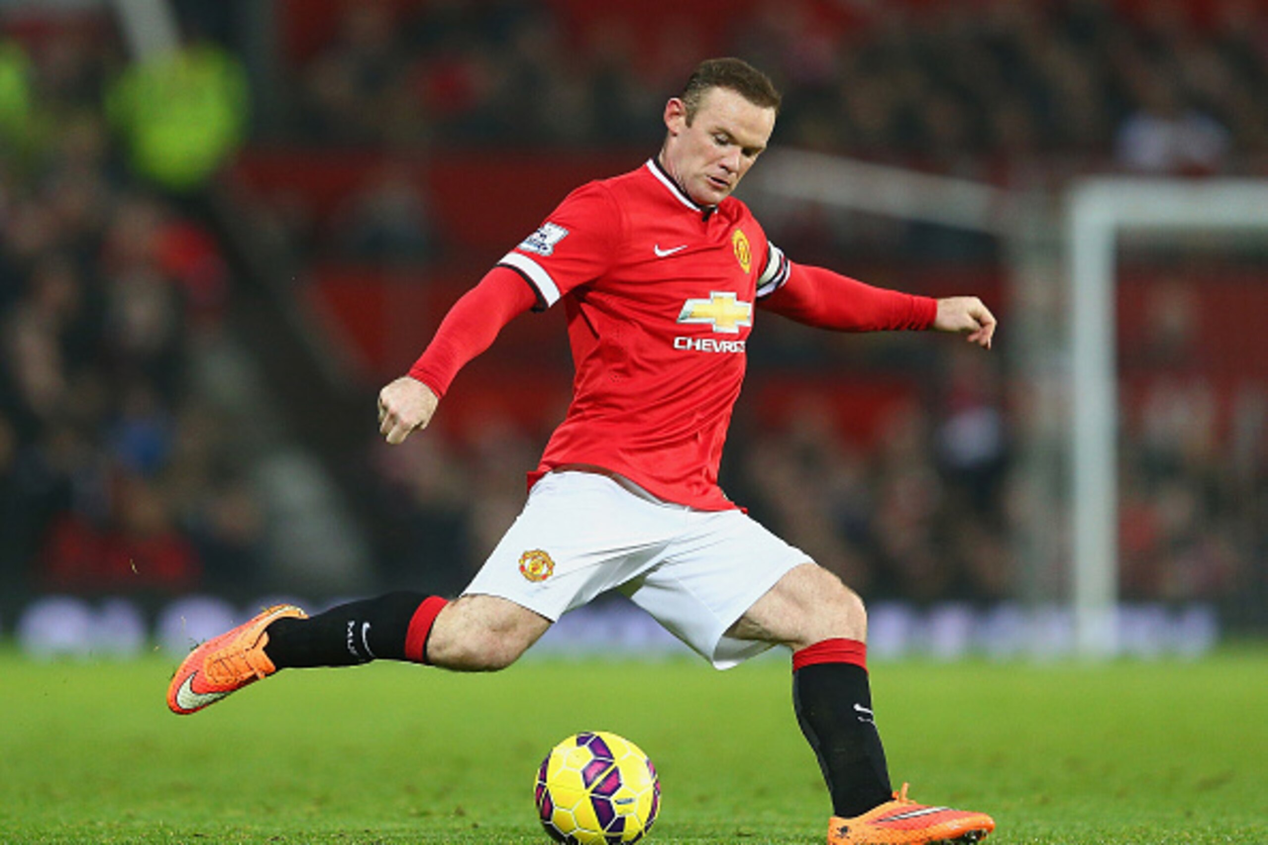 MANCHESTER, ENGLAND - NOVEMBER 29:  Wayne Rooney of Manchester United in action during the Barclays Premier League match between Manchester United and Hull City at Old Trafford on November 29, 2014 in Manchester, England.  (Photo by Clive Mason/Getty Imag