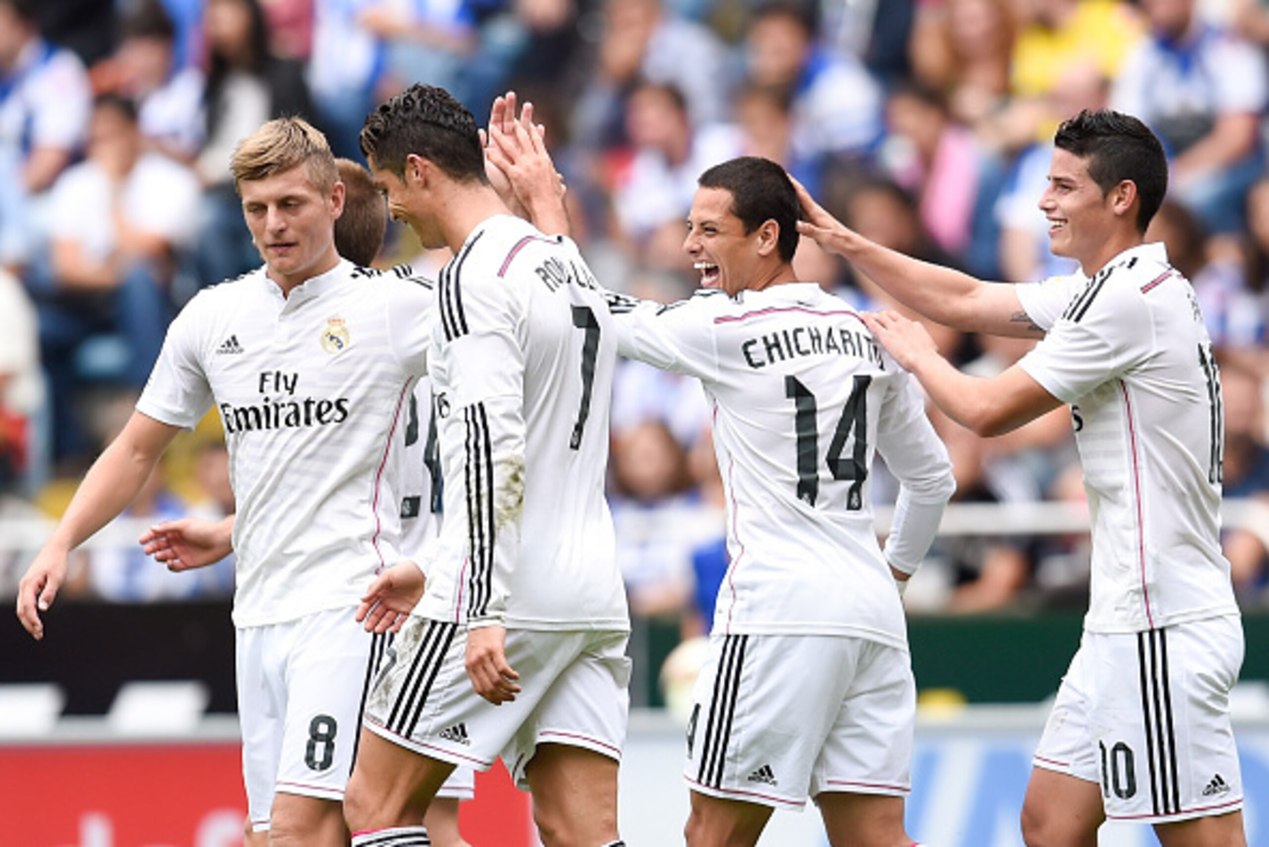 LA CORUNA, SPAIN - SEPTEMBER 20:  Chicharito Hernandez (2ndR) of Real Madrid CF celebrates with his teammates after scoring his team's seventh goal during the La Liga match between RC Deportivo La Coruna and Real Madrid CF at Riazor Stadium on September 2