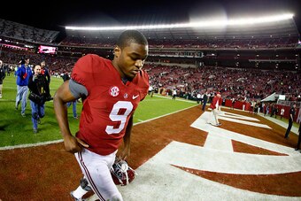 TUSCALOOSA, AL - NOVEMBER 29: Amari Cooper #9 of the Alabama Crimson Tide celebrates as he runs off the field after defeating the Auburn Tigers in the Iron Bowl at Bryant-Denny Stadium on November 29, 2014 in Tuscaloosa, Alabama. The Alabama Crimson Tide 