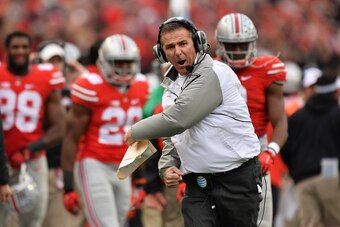 COLUMBUS, OH - NOVEMBER 29:  Head Coach Urban Meyer of the Ohio State Buckeyes celebrates after the Buckeyes scored on fourth and one in the fourth quarter against the Michigan Wolverines at Ohio Stadium on November 29, 2014 in Columbus, Ohio. Ohio State 