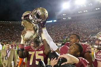 TALLAHASSEE, FL - NOVEMBER 29:  The Florida State Seminoles hold up a gator head after defeating the Florida Gators  at Doak Campbell Stadium on November 29, 2014 in Tallahassee, Florida.  (Photo by Mike Ehrmann/Getty Images)
