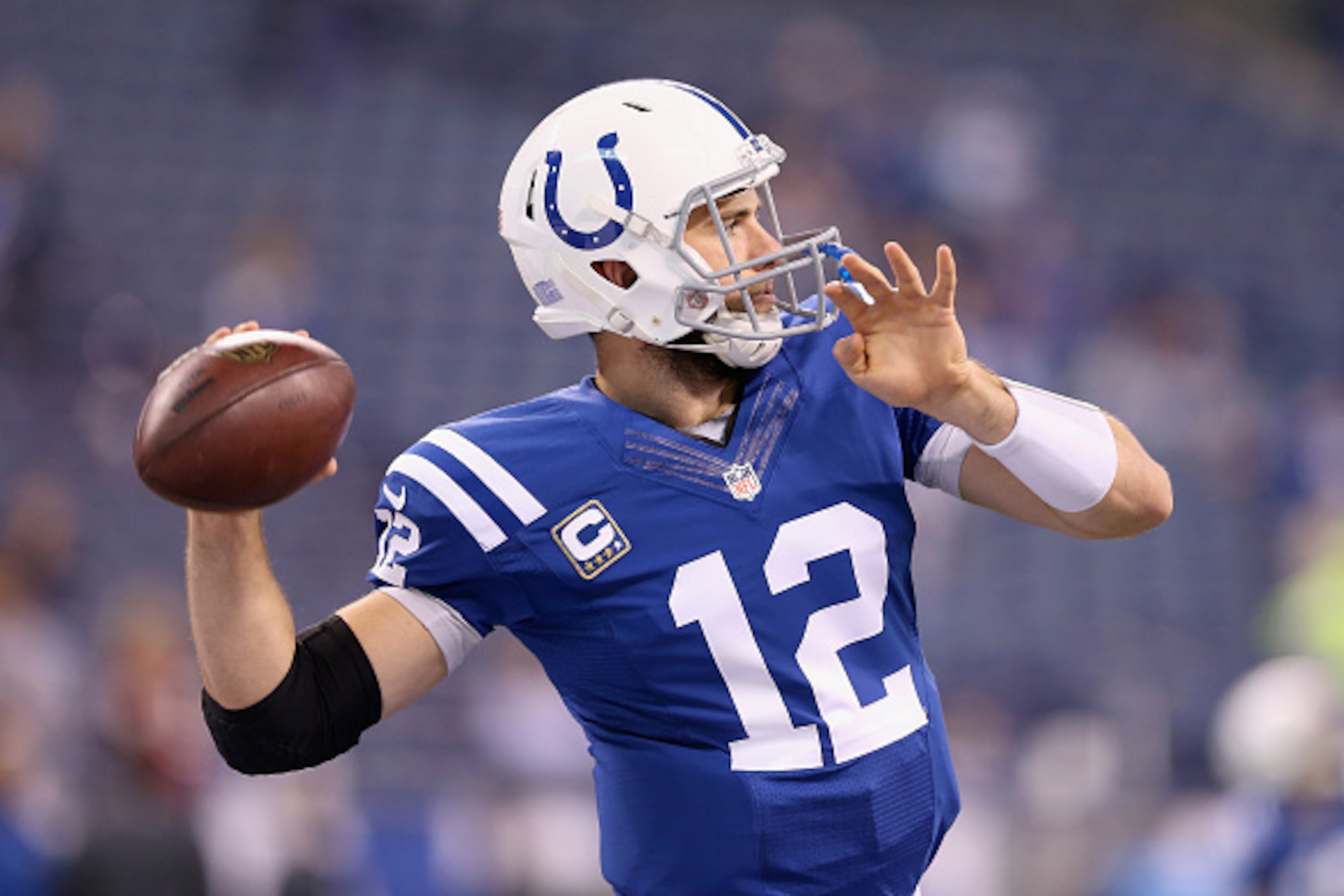 INDIANAPOLIS, IN - NOVEMBER 30:  Andrew Luck #12 of the Indianapolis Colts throws a pass before the game against the Washington Redskins at Lucas Oil Stadium on November 30, 2014 in Indianapolis, Indiana.  (Photo by Andy Lyons/Getty Images)