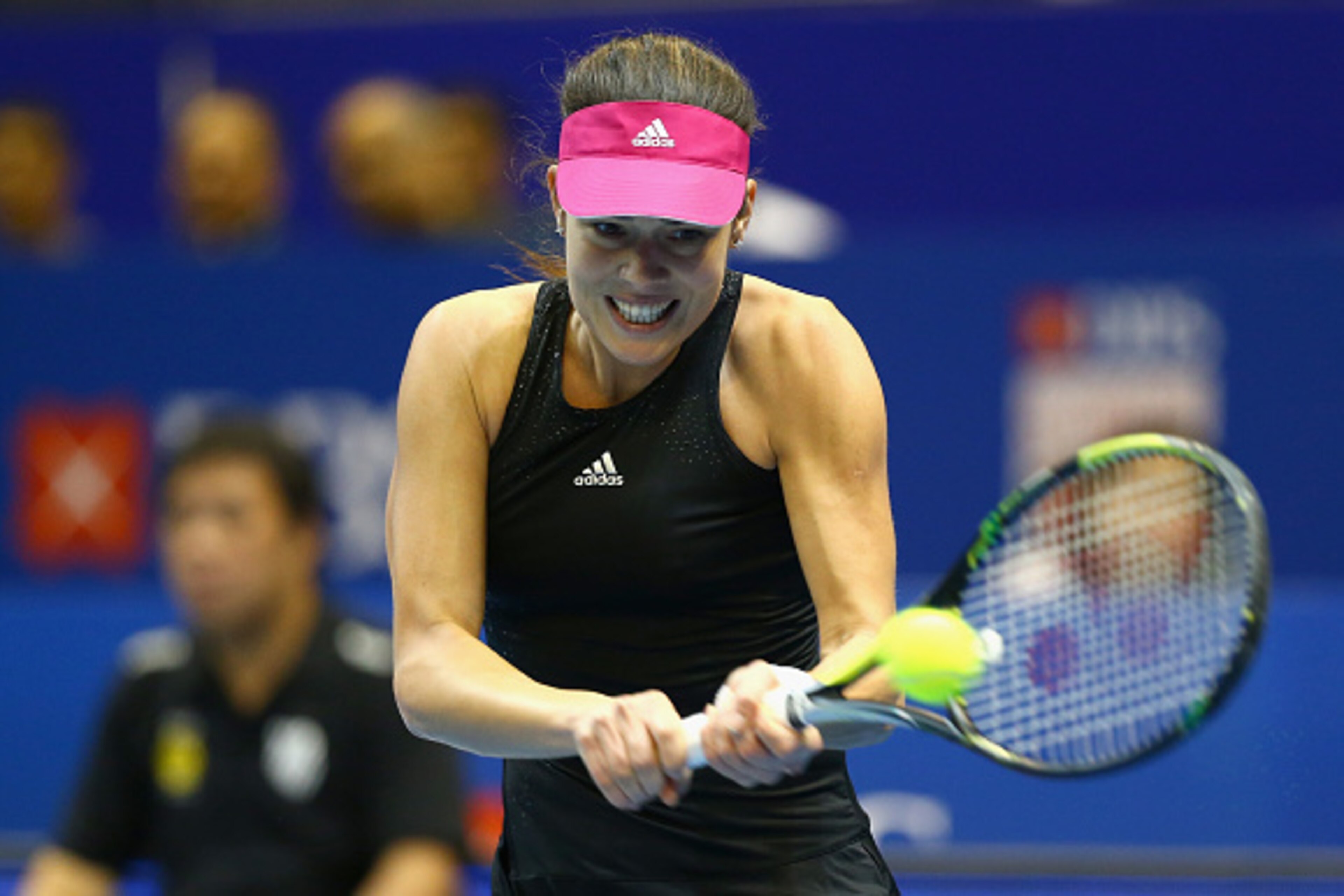SINGAPORE - DECEMBER 04:  Ana Ivanovic of the Indian Aces plays a backhand against Kirsten Flipkens of the Manila Mavericks during the Coca-Cola International Premier Tennis League at the Singapore Sports Hub on December 4, 2014 in Singapore.  (Photo by C