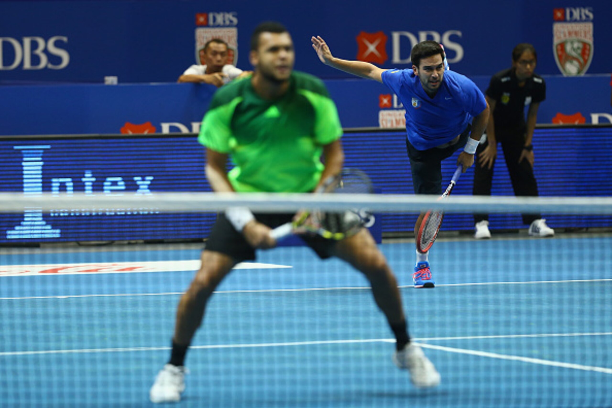 SINGAPORE - DECEMBER 04:  Jo-Wilfried Tsonga and Treat Huey of the Manila Mavericks in action against Gael Monfils and Rohan Bopanna of the Indian Aces during the Coca-Cola International Premier Tennis League at the Singapore Sports Hub on December 4, 201