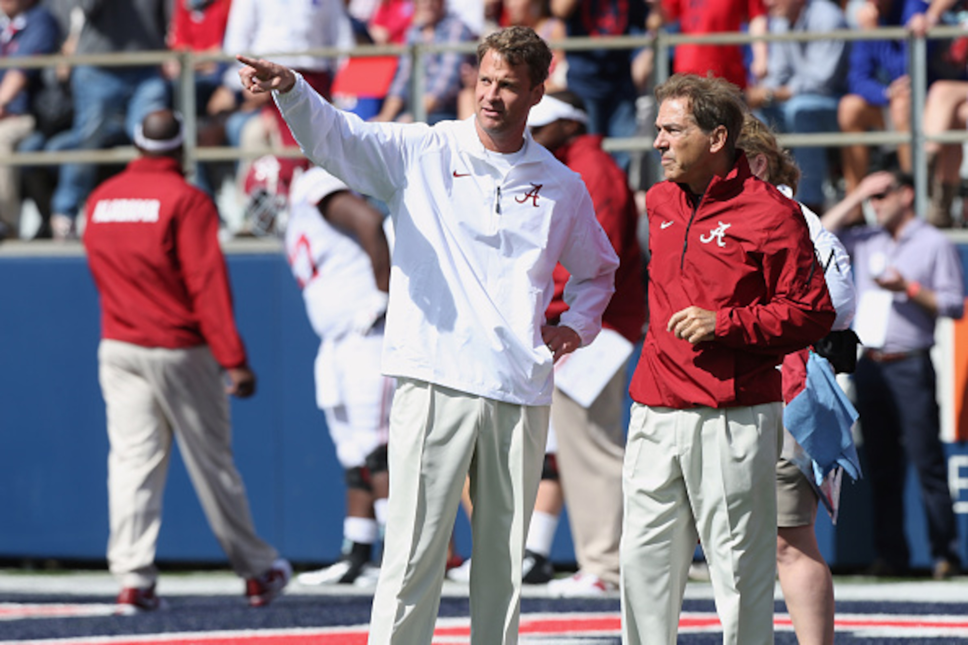OXFORD, MS - OCTOBER 4: Nick Saban, head coach of the Alabama Crimson Tide talks with Lane Kiffin, offensive coordinator of the Alabama Crimson Tide during warmups before a game against the Ole Miss Rebels on October 4, 2014 at Vaught-Hemingway Stadium in