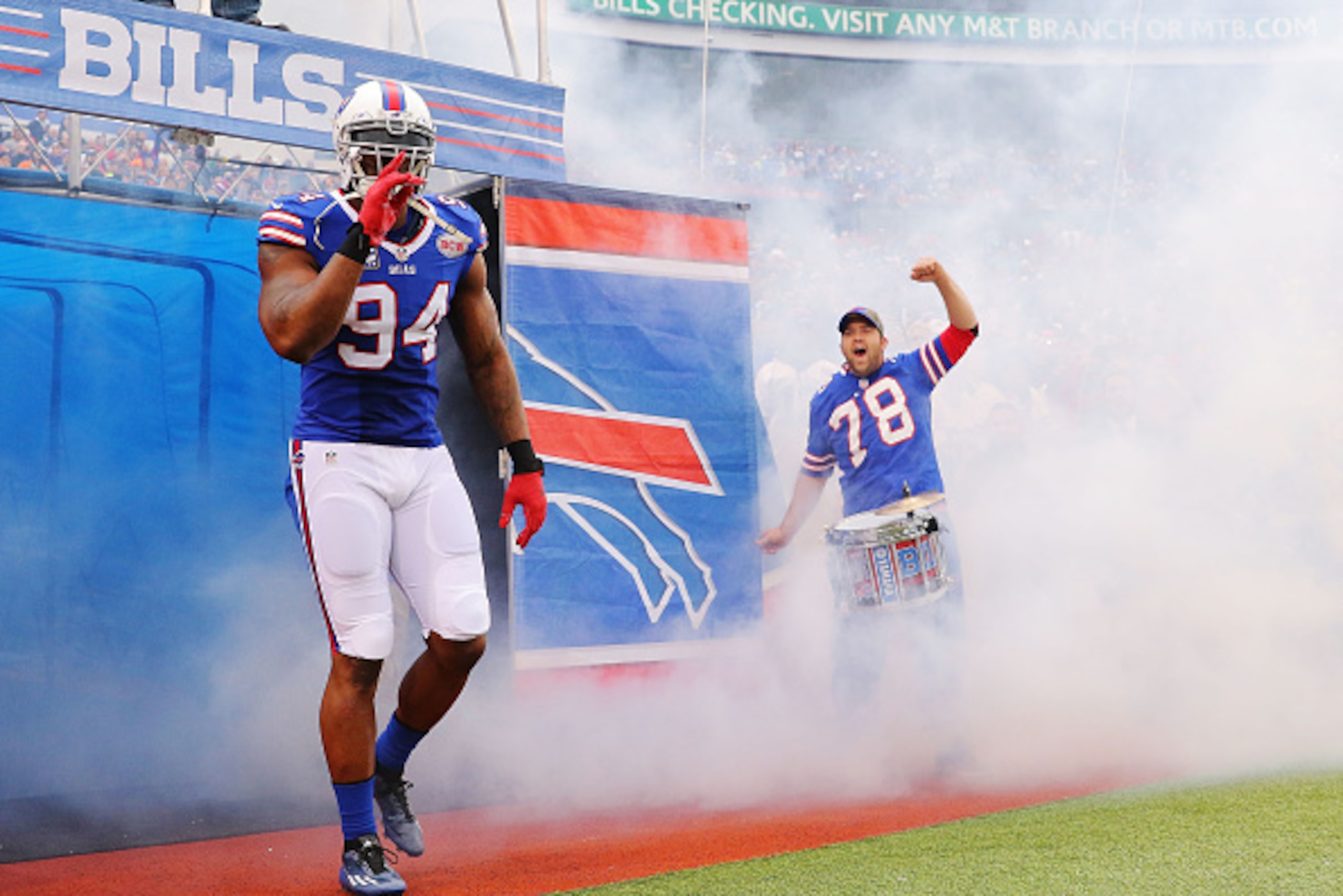 ORCHARD PARK, NY - NOVEMBER 30:   Mario Williams #94 of the Buffalo Bills leads his team onto the field before the game against the Cleveland Browns at Ralph Wilson Stadium on November 30, 2014 in Orchard Park, New York.  (Photo by Brett Carlsen/Getty Ima