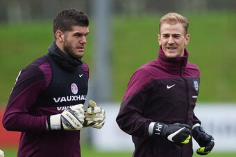 BURTON-UPON-TRENT, ENGLAND - NOVEMBER 14:  Goalkeepers Fraser Forster (L) and Joe Hart warm up during an England training session, ahead of the UEFA European Championship qualifier match against Slovenia, at St Georges Park on November 14, 2014 in Burton-