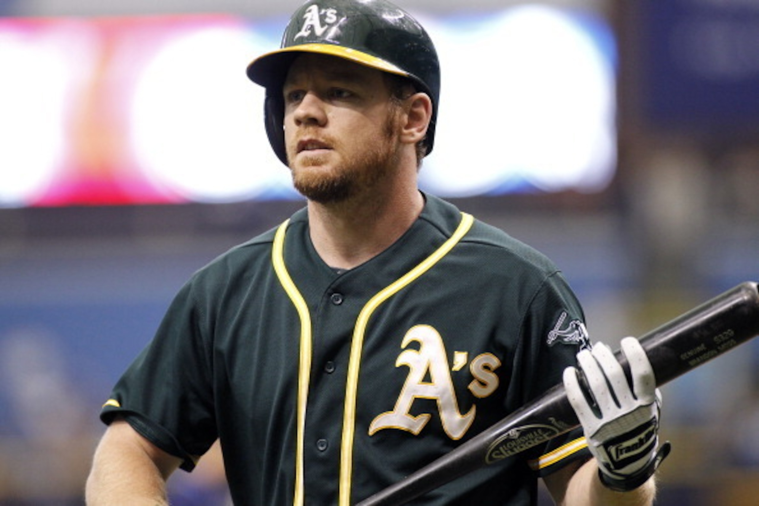 ST. PETERSBURG, FL - MAY 22:  Brandon Moss #37 of the Oakland Athletics walks back to the dugout after striking out looking to end the top of the first inning of a game against the Tampa Bay Rays on May 22, 2014 at Tropicana Field in St. Petersburg, Flori