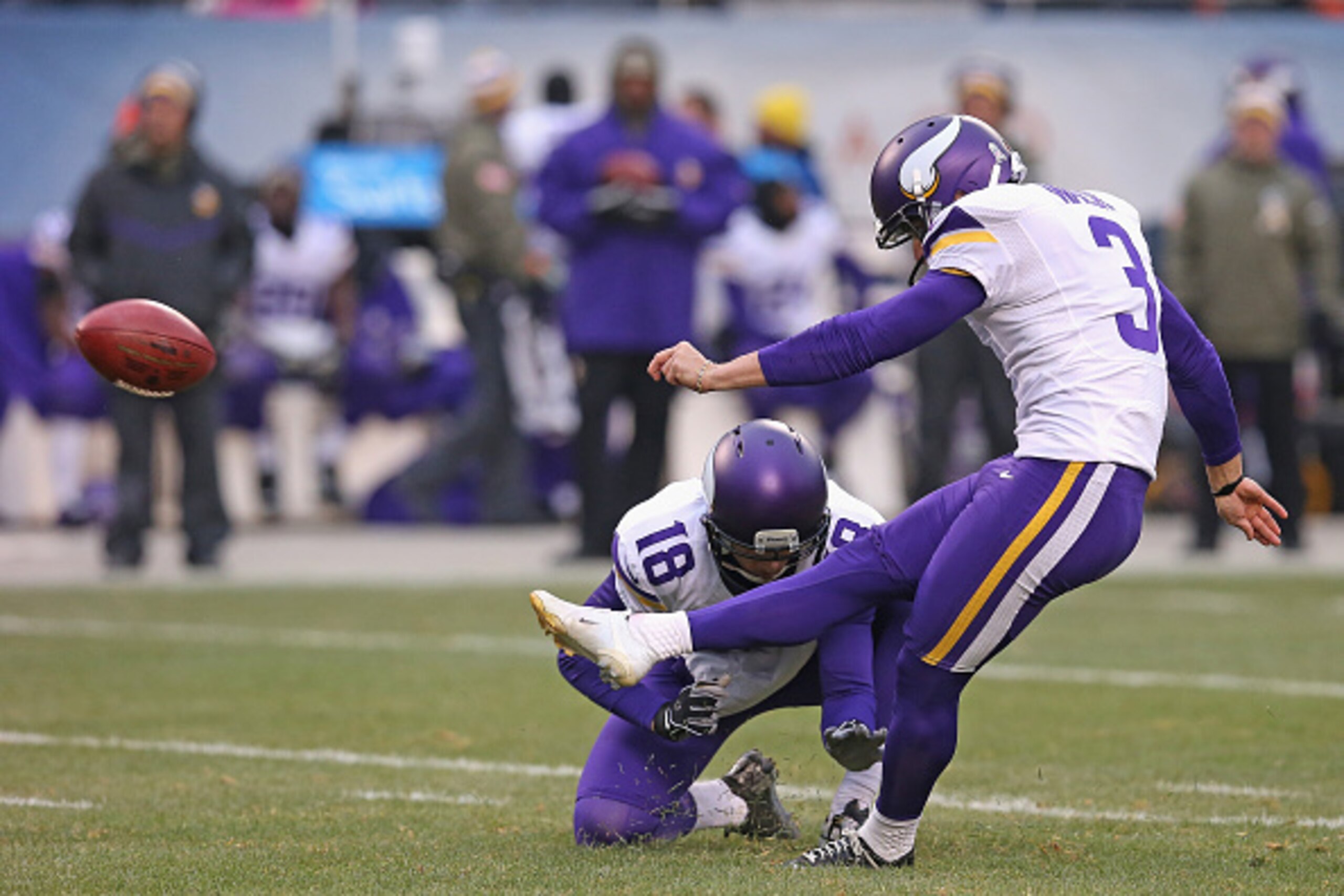 CHICAGO, IL - NOVEMBER 16:  Blair Walsh #3 of the Minnesota Vikings attempts a field goal out of the hold of Jeff Locke #18 against the Chicago Bears at Soldier Field on October 19, 2014 in Chicago, Illinois. The Bears defeated the Vikings 21-13.  (Photo 