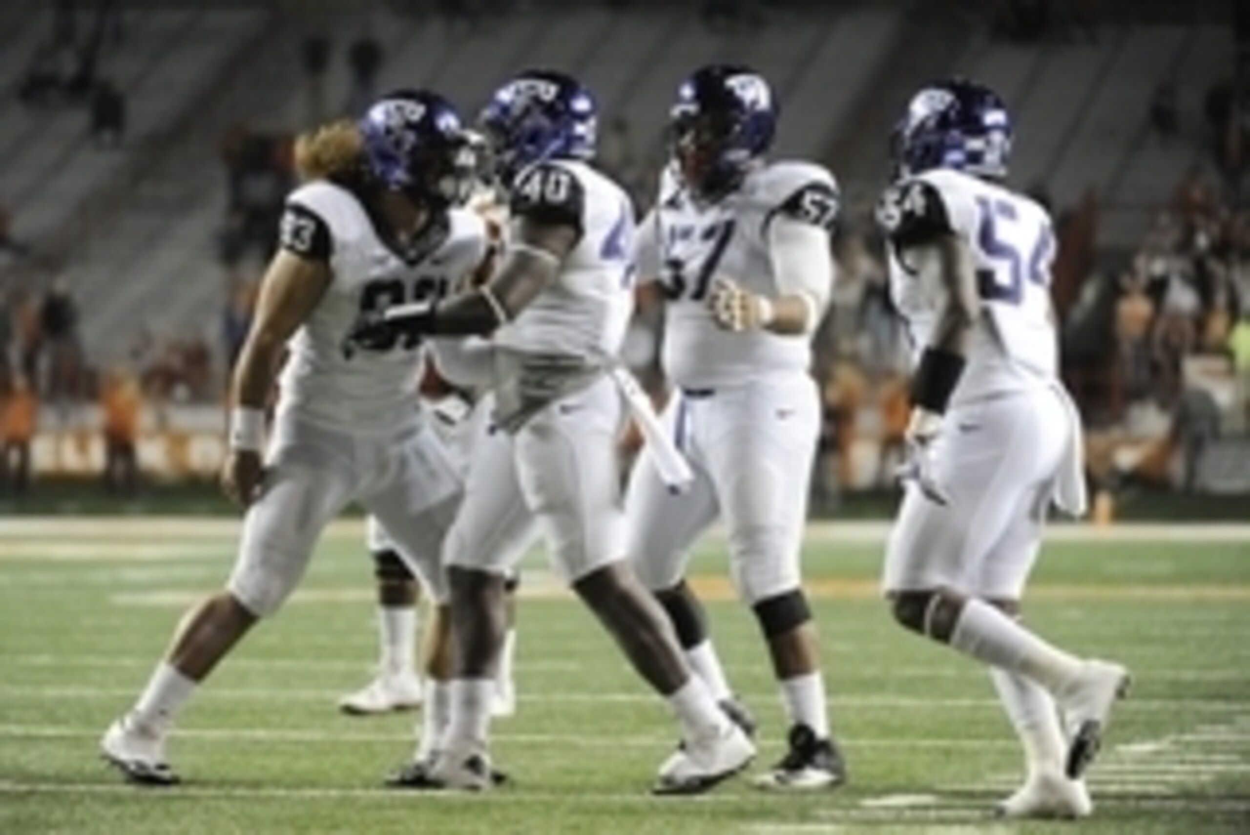 Nov 27, 2014; Austin, TX, USA; TCU Horned Frogs defensive end James McFarland (40) celebrates with teammates after a sack against the Texas Longhorns during the game at Darrell K Royal-Texas Memorial Stadium. Mandatory Credit: Brendan Maloney-USA TODAY Sp