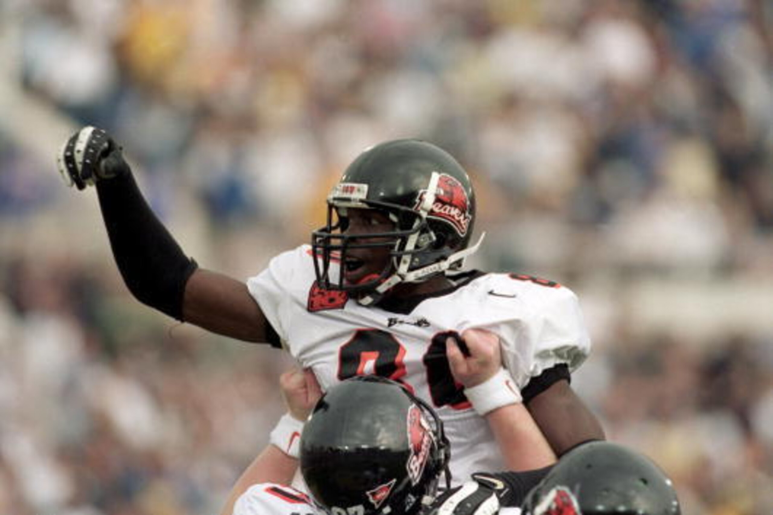 21 Oct 2000:  Chad Johnson #80 of the Oregon State Beavers celebrates on the field with teammates after he makes a touchdown during the game against the UCLA Bruins at the Rose Bowl in Pasadena, California. The Beavers defeated the Bruins 44-38. Mandatory