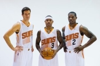 Sep 29, 2014; Phoenix, AZ, USA; Phoenix Suns guard Goran Dragic (left), guard Isaiah Thomas (center) and guard Eric Bledsoe pose for a portrait during media day at the US Airways Center. Mandatory Credit: Mark J. Rebilas-USA TODAY Sports