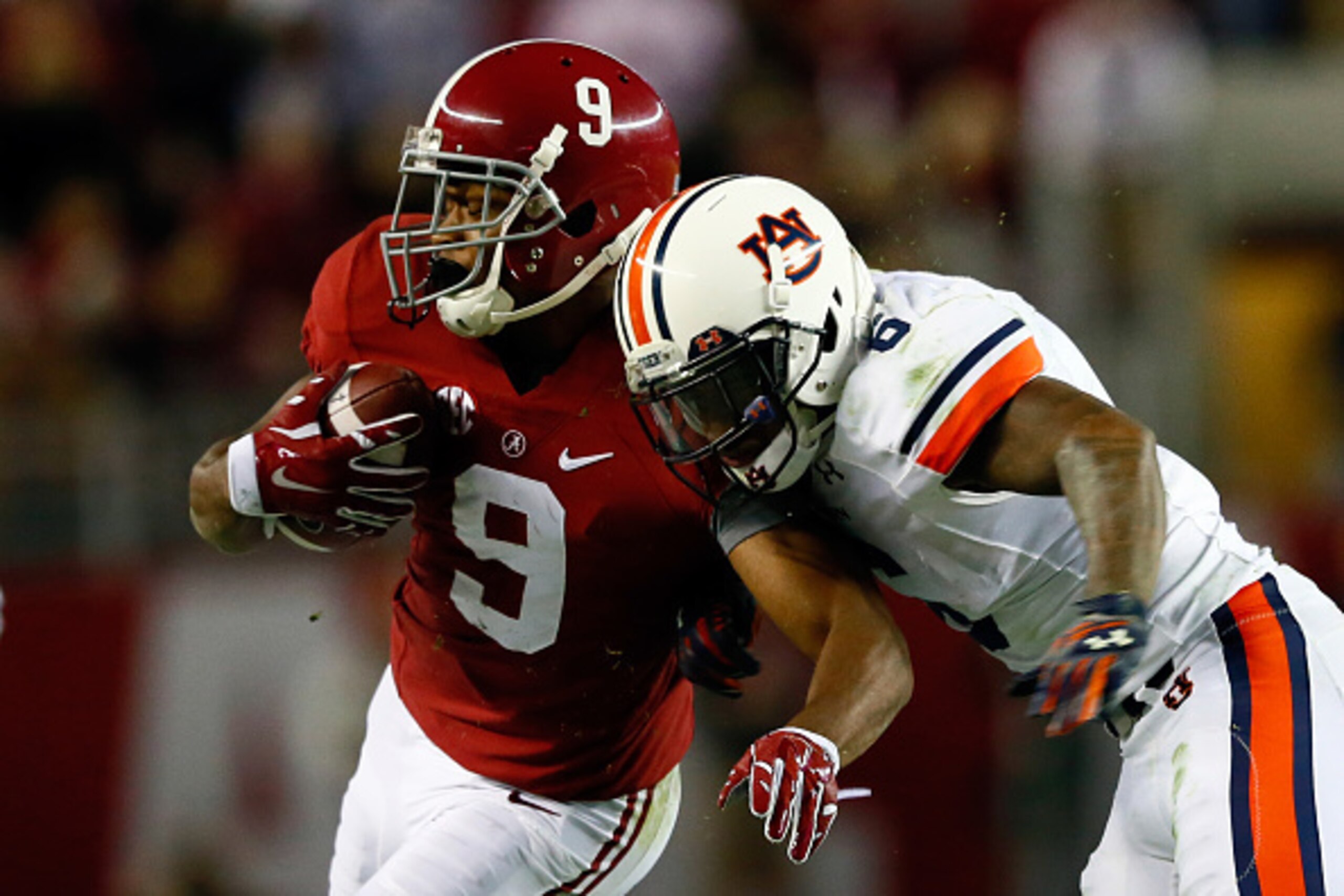 TUSCALOOSA, AL - NOVEMBER 29:  Amari Cooper #9 of the Alabama Crimson Tide catches a pass in the fourth quarter against the Auburn Tigers during the Iron Bowl at Bryant-Denny Stadium on November 29, 2014 in Tuscaloosa, Alabama.  (Photo by Kevin C. Cox/Get