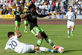 LOS ANGELES, CA - NOVEMBER 23:  Obafemi Martins #9 of Seattle Sounders FC has his pass blocked by A.J. DeLaGarza #20 of Los Angeles Galaxy during the Western Conference Final at StubHub Center on November 23, 2014 in Los Angeles, California.  (Photo by Ha