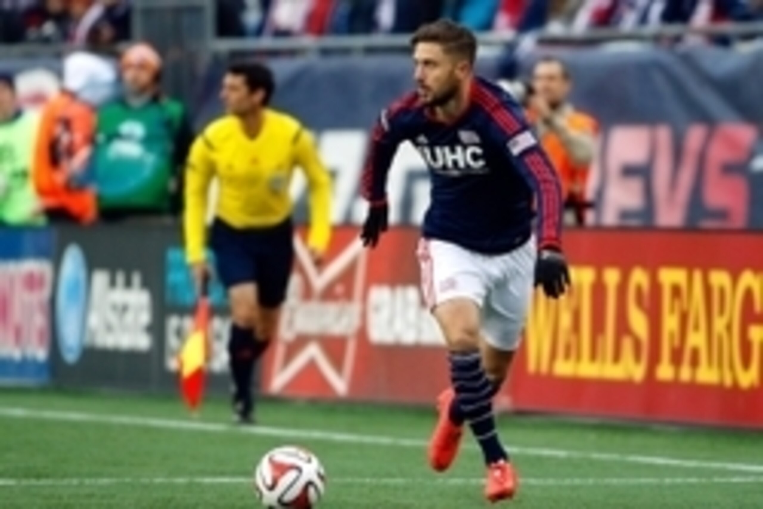 Nov 29, 2014; Foxborough, MA, USA; New England Revolution defender/midfielder Chris Tierney (8) controls the ball during the Eastern Conference Championship against the New York Red Bulls at Gillette Stadium. Mandatory Credit: Winslow Townson-USA TODAY Sp