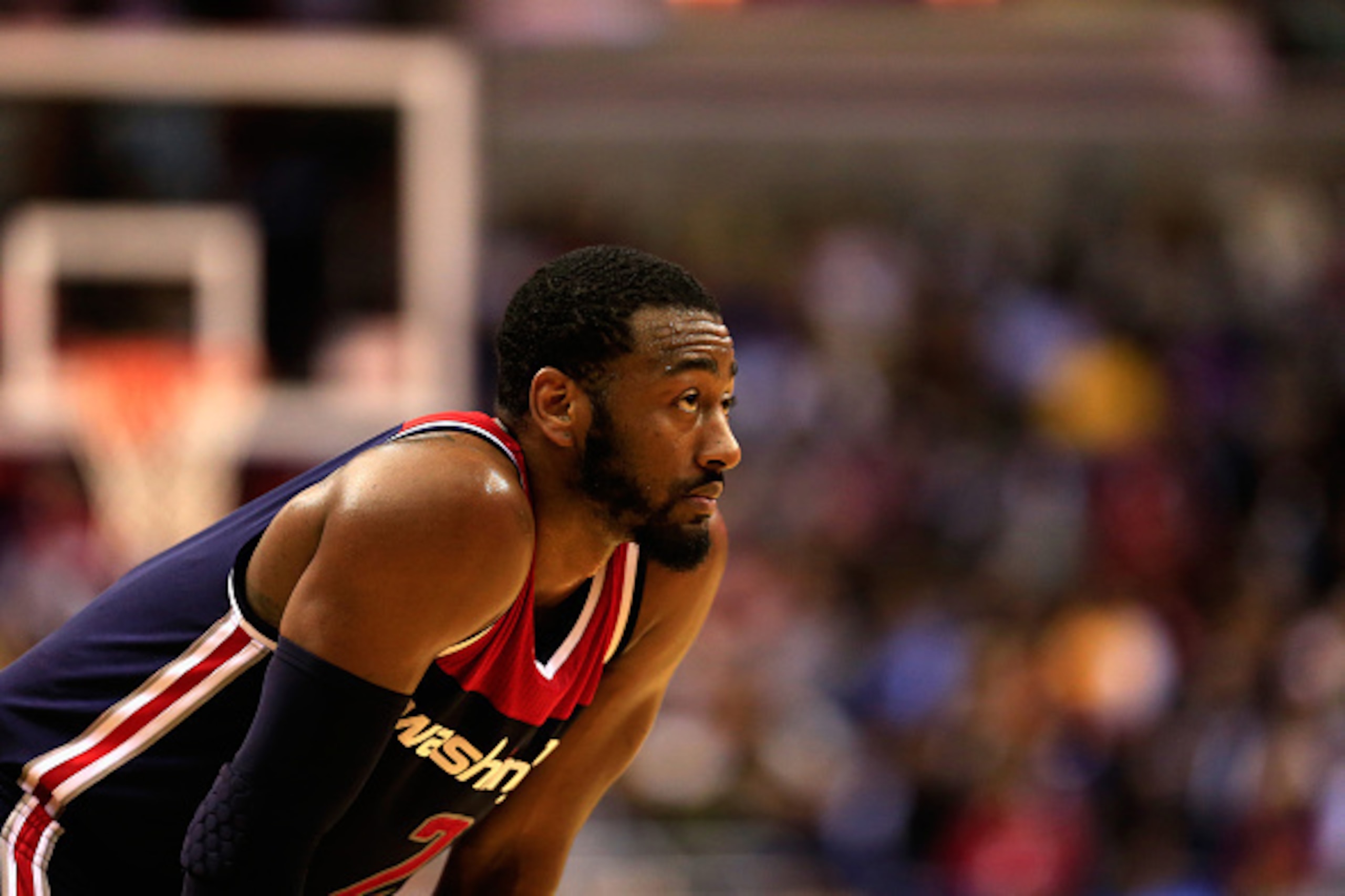 WASHINGTON, DC - DECEMBER 03: John Wall #2 of the Washington Wizards looks on during a free throw attempt by the Los Angeles Lakers during the first half at Verizon Center on December 3, 2014 in Washington, DC. NOTE TO USER: User expressly acknowledges an