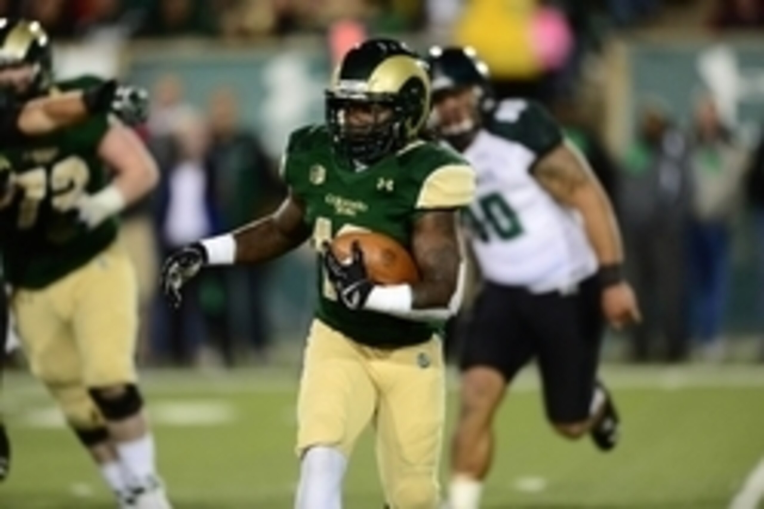 Nov 8, 2014; Fort Collins, CO, USA; Colorado State Rams running back Dee Hart (10) carries the football in the third quarter against the Hawaii Warriors at Hughes Stadium. Mandatory Credit: Ron Chenoy-USA TODAY Sports