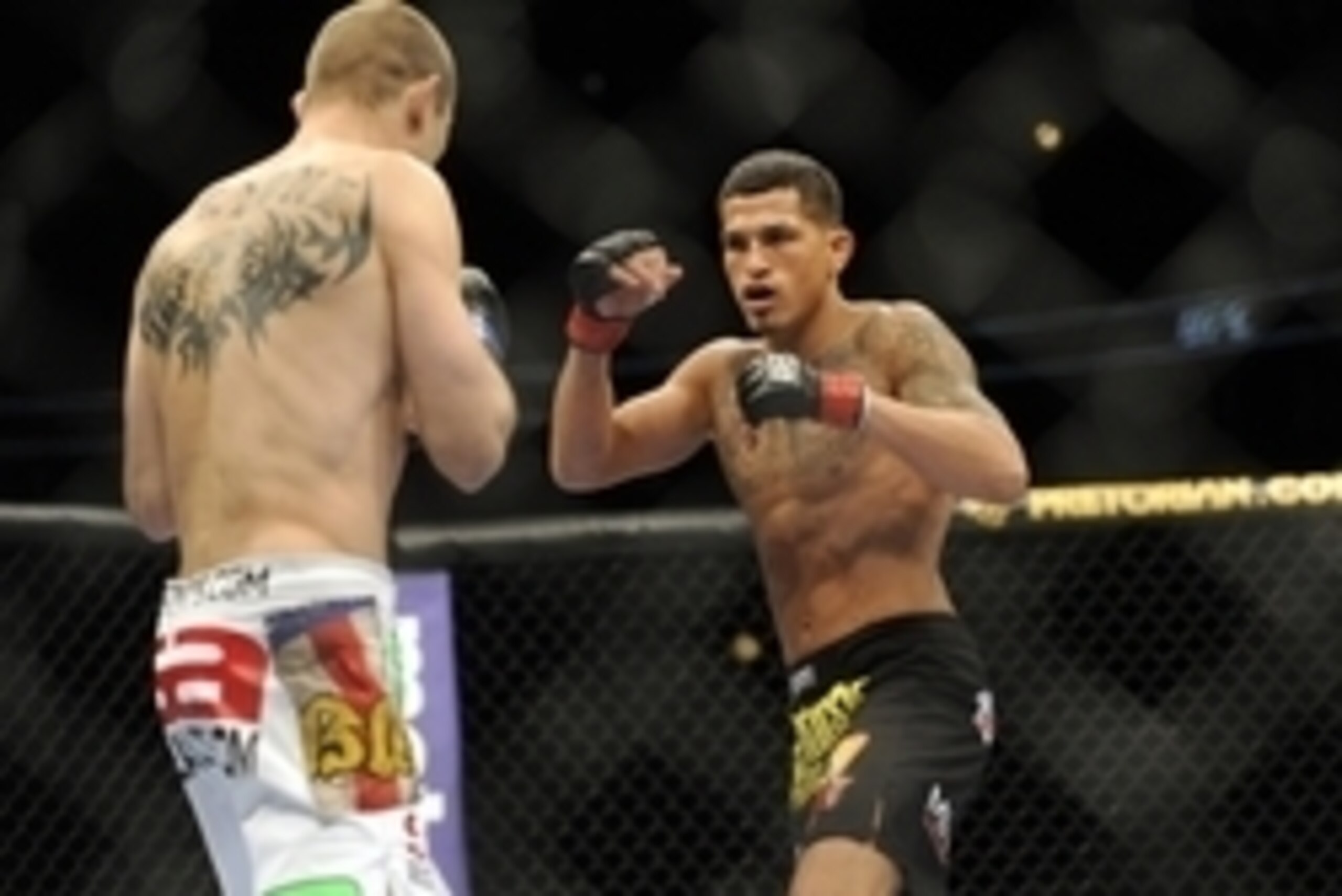 Jan 26, 2013; Chicago, IL, USA;  Donald Cerrone (white shorts) fights against Anthony Pettis (black shorts) during UFC on FOX 6 at the United Center.  Mandatory Credit: David Banks-USA TODAY Sports