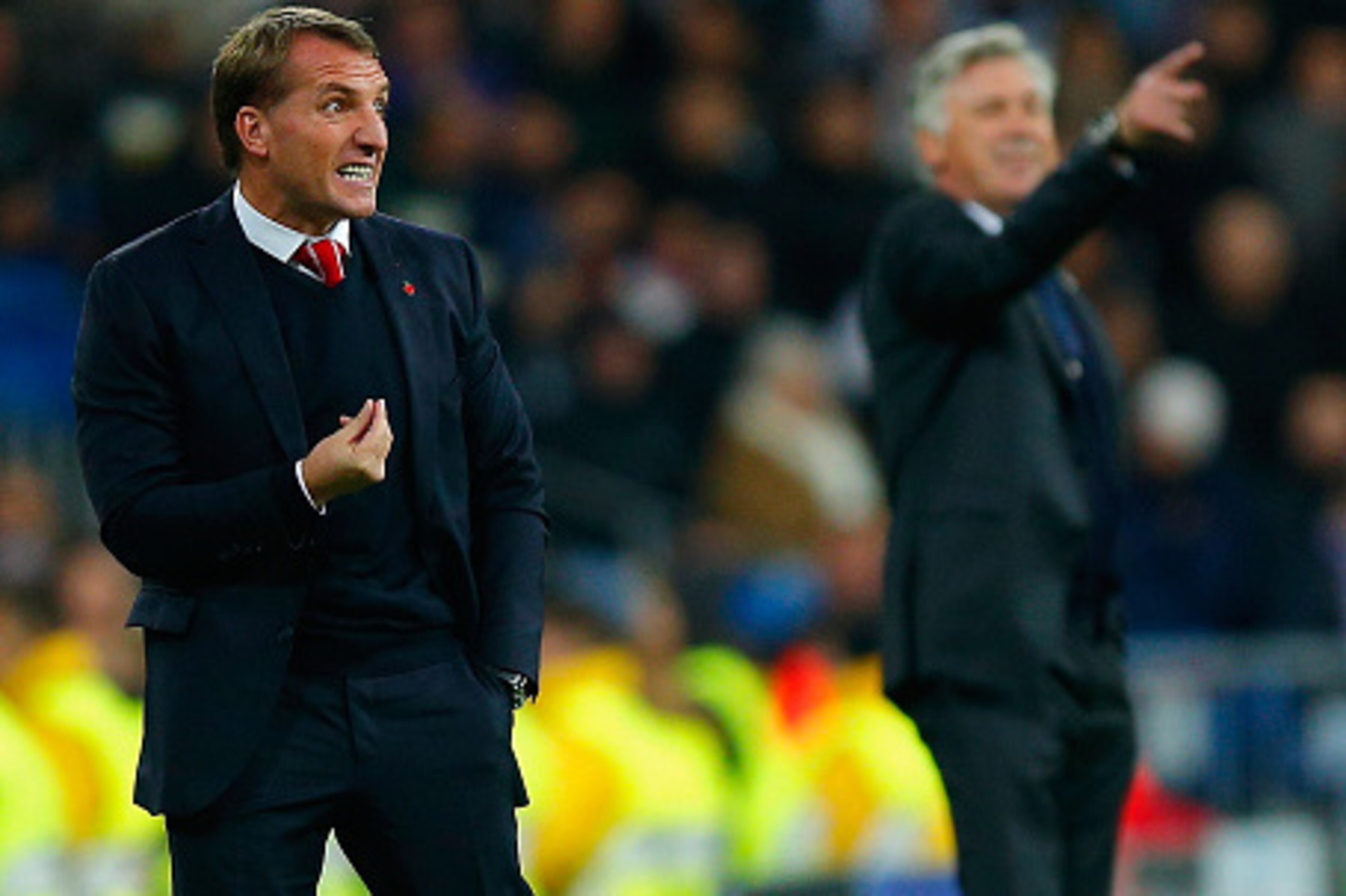 MADRID, SPAIN - NOVEMBER 04: Brendan Rodgers, manager of Liverpool and Head Coach Carlo Ancelotti of Real Madrid CF give instructions from the touchline during the UEFA Champions League Group B match between Real Madrid CF and Liverpool FC at Estadio Sant