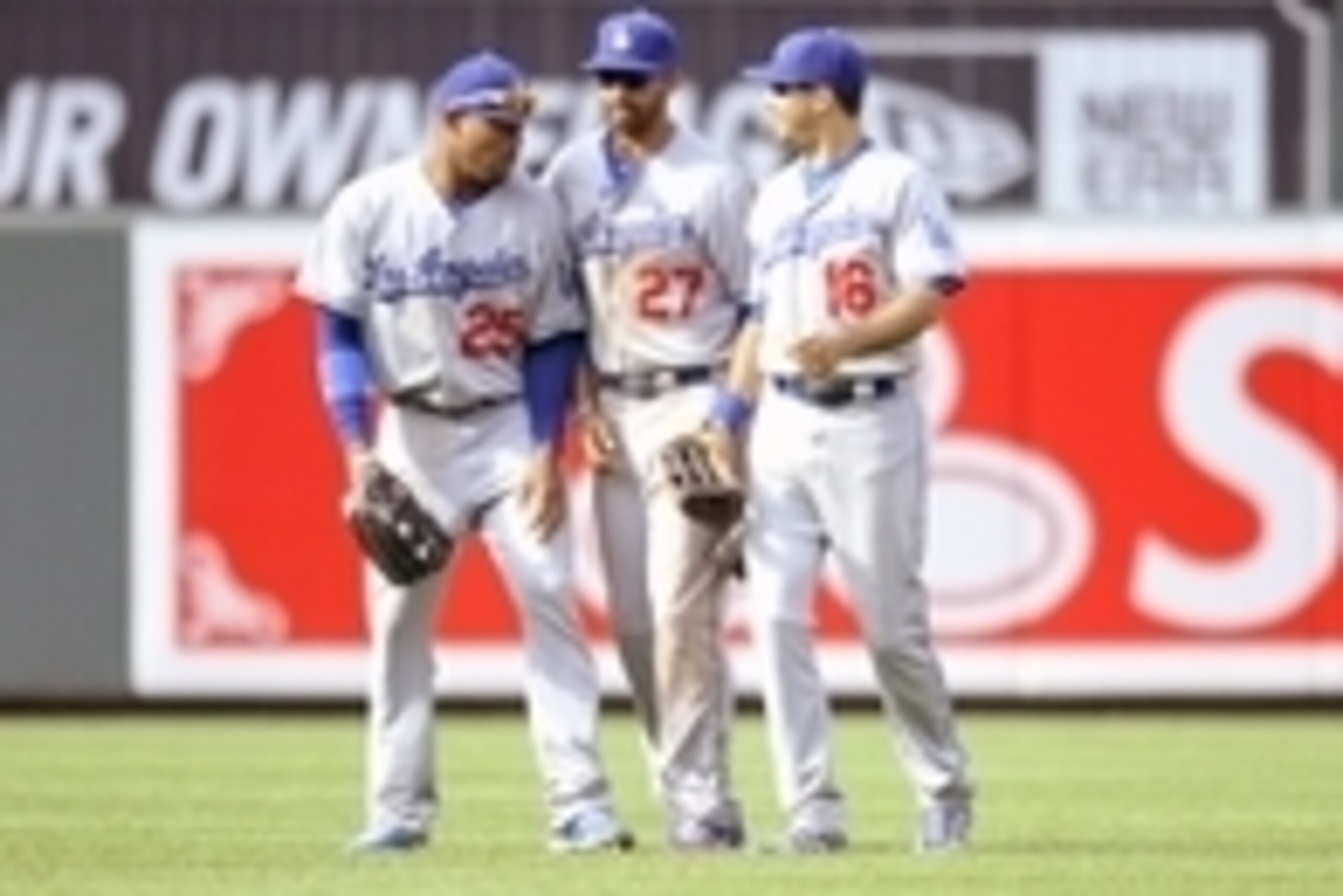 Apr 21, 2013; Baltimore, MD, USA; Los Angeles Dodgers outfielders Carl Crawford (25), and Matt Kemp (27) and Andre Ethier (16) celebrate after a game against the Baltimore Orioles at Oriole Park at Camden Yards. The Dodgers defeated the Orioles 7 - 4. Man