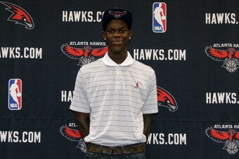 ATLANTA, GA - JUNE 29: Dennis Schroeder of the Atlanta Hawks poses for the media at an introductory press conference on June 29, 2013 at Philips Arena in Atlanta, Georgia. NOTE TO USER: User expressly acknowledges and agrees that, by downloading and or us