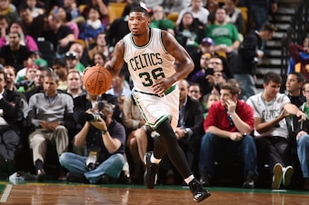 BOSTON, MA - OCTOBER 6: Marcus Smart #36 of the Boston Celtics dribbles the ball against the Philadelphia 76ers on October 6, 2014 at the TD Garden in Boston, Massachusetts.  NOTE TO USER: User expressly acknowledges and agrees that, by downloading and or