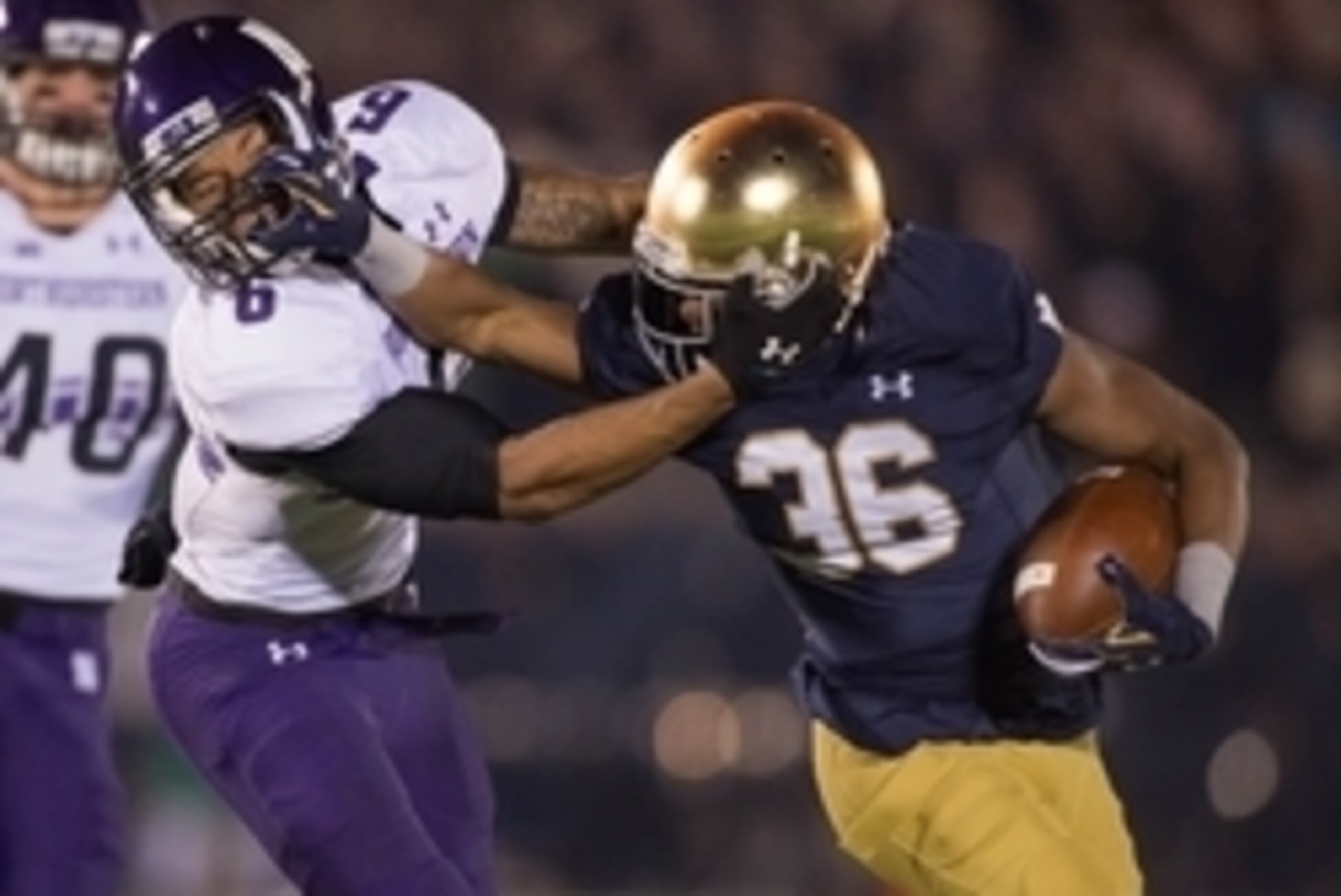 Nov 15, 2014; South Bend, IN, USA; Northwestern Wildcats wide receiver Tony Jones (6) attempts to tackle Notre Dame Fighting Irish cornerback Cole Luke (36) after Luke intercepted a pass in the fourth quarter at Notre Dame Stadium. Northwestern won 43-30 Nov 15, 2014; South Bend, IN, USA; Northwestern Wildcats wide receiver Tony Jones (6) attempts to tackle Notre Dame Fighting Irish cornerback Cole Luke (36) after Luke intercepted a pass in the fourth quarter at Notre Dame Stadium. Northwestern won 43-30