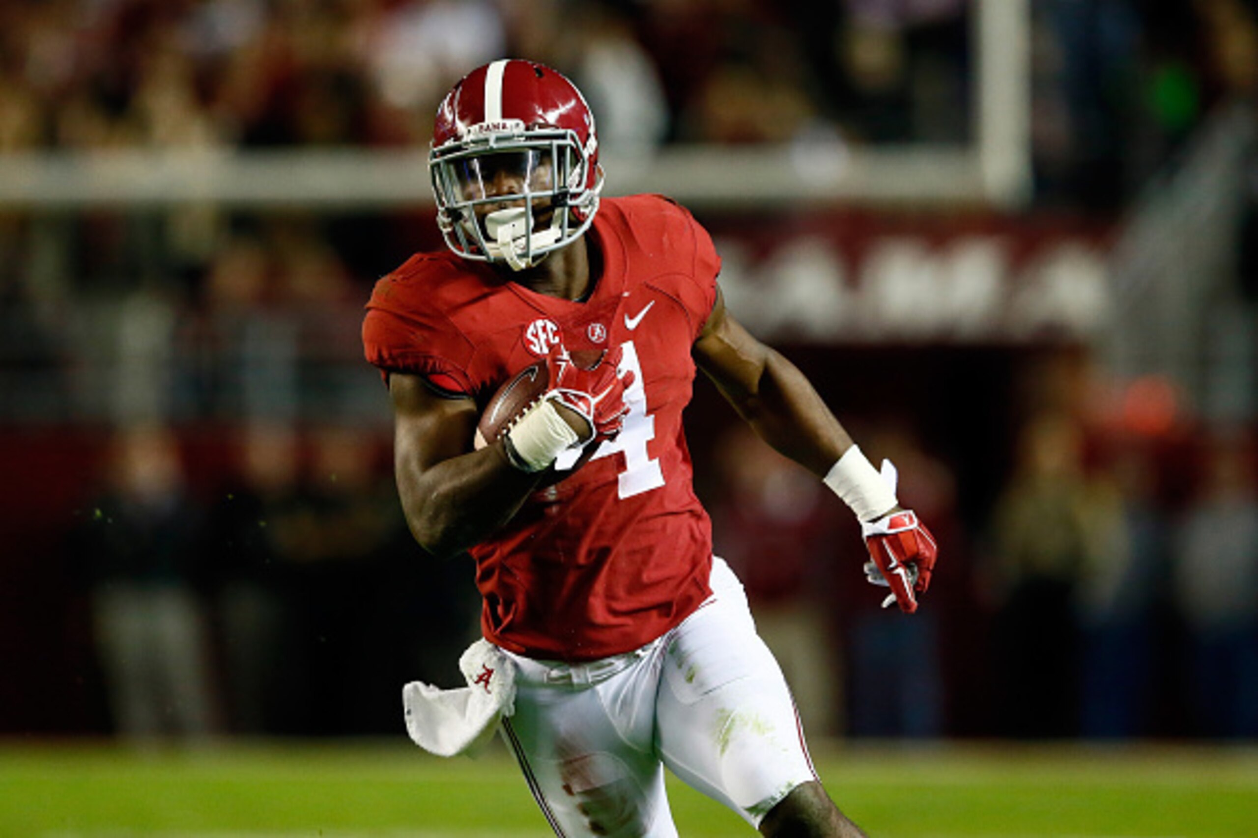 TUSCALOOSA, AL - NOVEMBER 29:  T.J. Yeldon #4 of the Alabama Crimson Tide runs the ball in the second quarter against the Auburn Tigers during the Iron Bowl at Bryant-Denny Stadium on November 29, 2014 in Tuscaloosa, Alabama.  (Photo by Kevin C. Cox/Getty