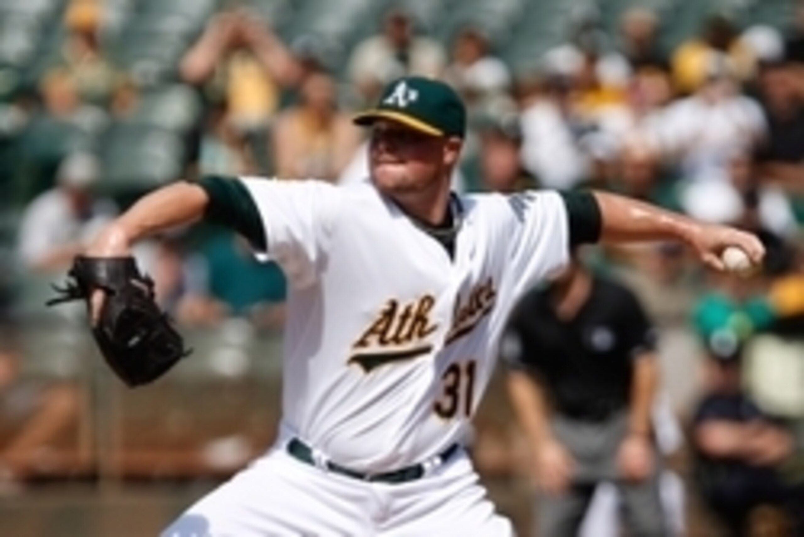 Sep 24, 2014; Oakland, CA, USA; Oakland Athletics starting pitcher Jon Lester (31) pitches the ball against the Los Angeles Angels during the first inning at O.co Coliseum. Mandatory Credit: Kelley L Cox-USA TODAY Sports