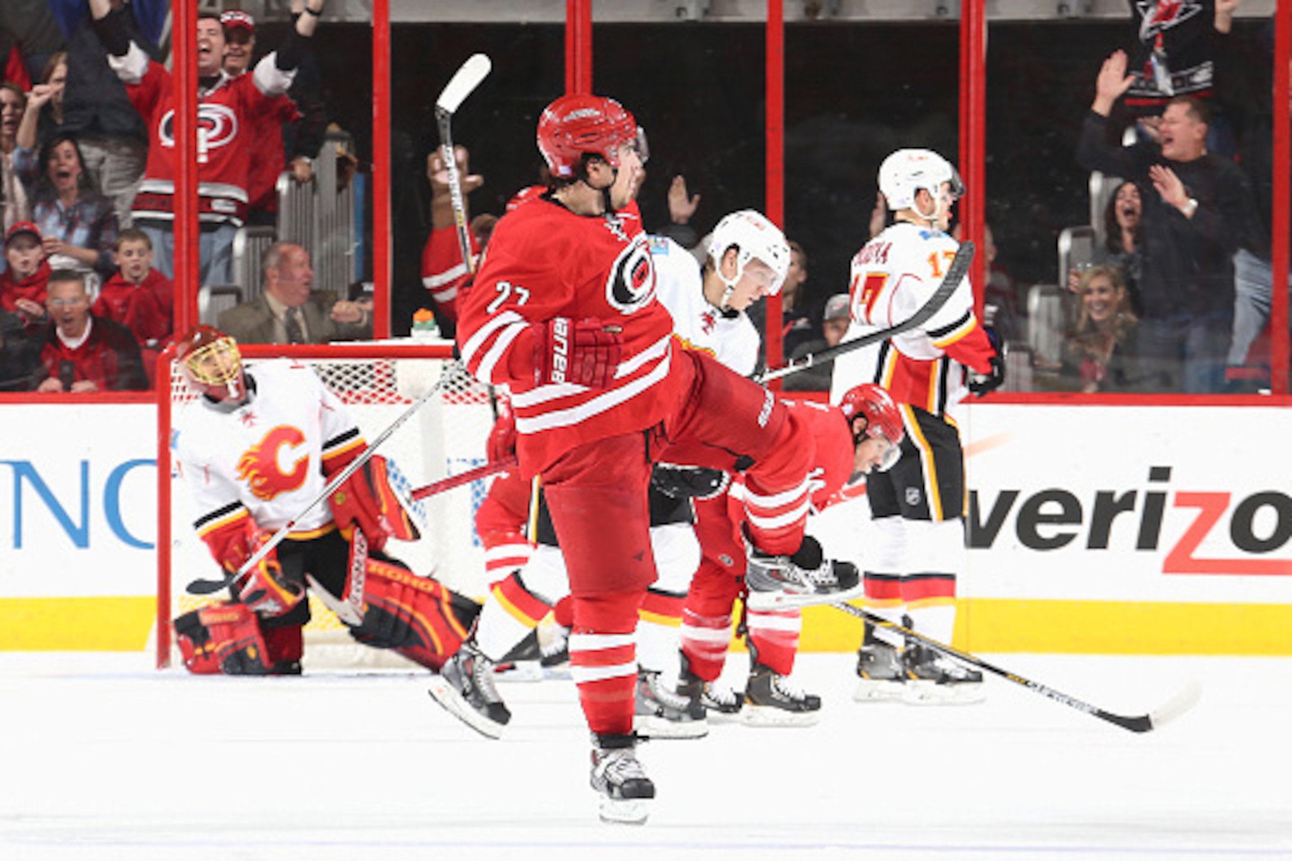 RALEIGH, NC - NOVEMBER 10: Justin Faulk #27 of the Carolina Hurricanes celebrates scoring a goal in the 2nd period during their NHL game against the Calgary Flames at PNC Arena on November 10, 2014 in Raleigh, North Carolina.  (Photo by Gregg Forwerck/NHL