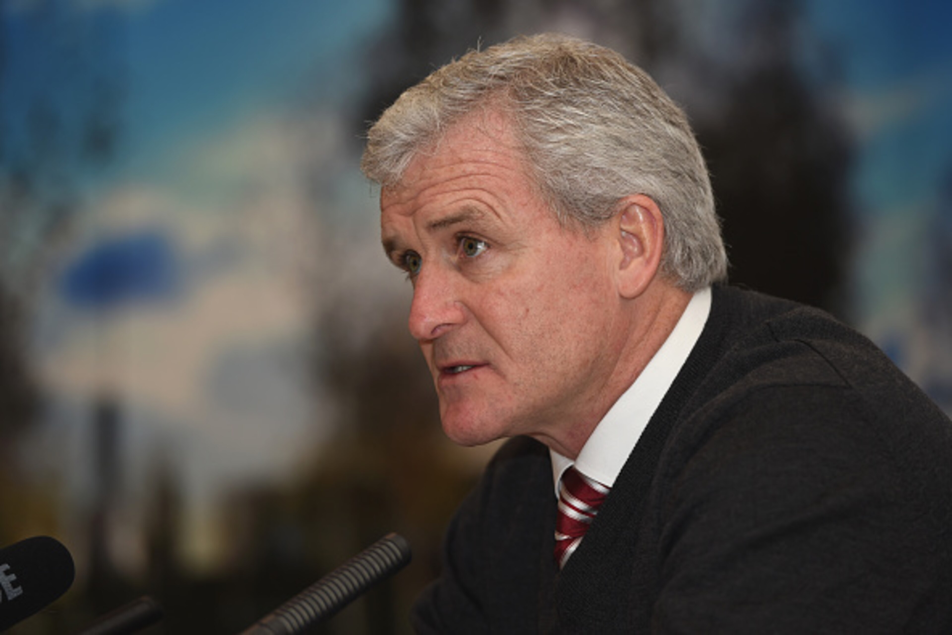 STAFFORD, ENGLAND - DECEMBER 04:  Stoke City manager Mark Hughes speaks to the media at The National Memorial Arboretum on December 4, 2014 in Stafford, England.  (Photo by Michael Regan/Getty Images)
