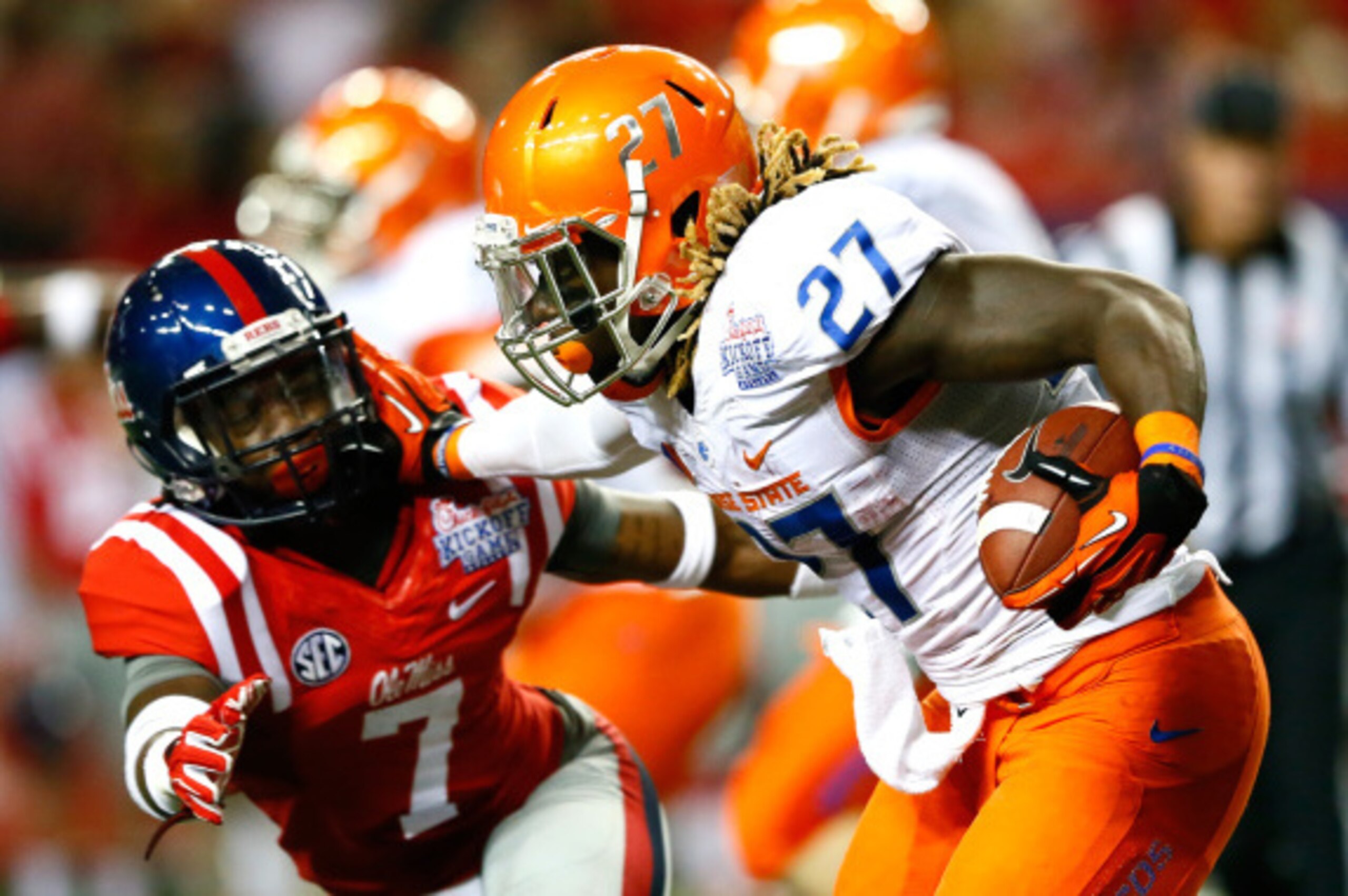 ATLANTA, GA - AUGUST 28:  Jay Ajayi #27 of the Boise State Broncos stiff arms Trae Elston #7 of the Mississippi Rebels at Georgia Dome on August 28, 2014 in Atlanta, Georgia.  (Photo by Kevin C. Cox/Getty Images)