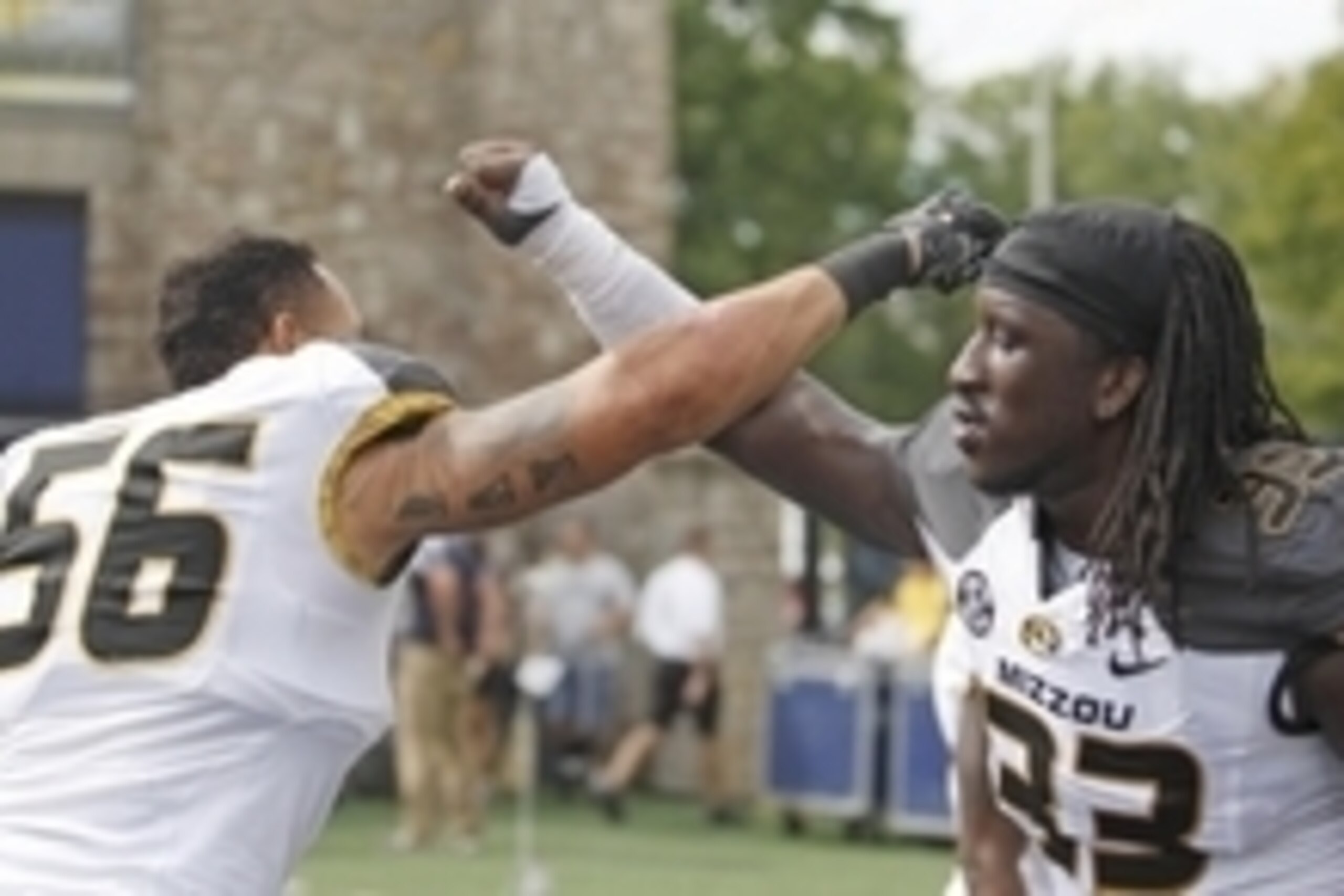 Sep 6, 2014; Toledo, OH, USA; Missouri Tigers defensive lineman Shane Ray (56) and defensive lineman Markus Golden (33) celebrate after the game against the Toledo Rockets at Glass Bowl. Tigers beat the Rockets 49-24. Mandatory Credit: Raj Mehta-USA TODAY