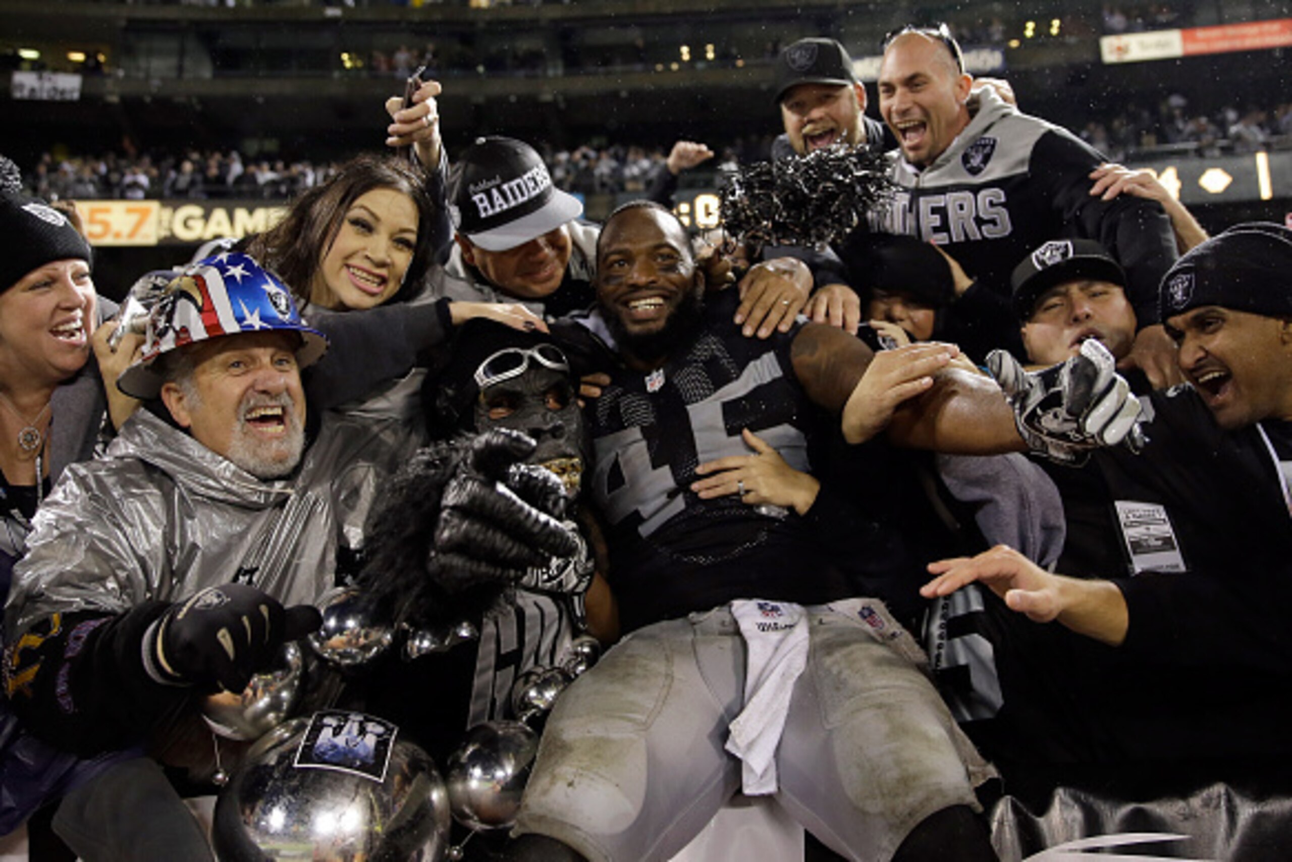 OAKLAND, CA - NOVEMBER 20: Marcel Reece #45 of the Oakland Raiders celebrates with fans in the Black Hole after the Raiders beat the Kansas City Chiefs at O.co Coliseum on November 20, 2014 in Oakland, California. (Photo by Ezra Shaw/Getty Images) OAKLAND, CA - NOVEMBER 20: Marcel Reece #45 of the Oakland Raiders celebrates with fans in the Black Hole after the Raiders beat the Kansas City Chiefs at O.co Coliseum on November 20, 2014 in Oakland, California. (Photo by Ezra Shaw/Getty Images)