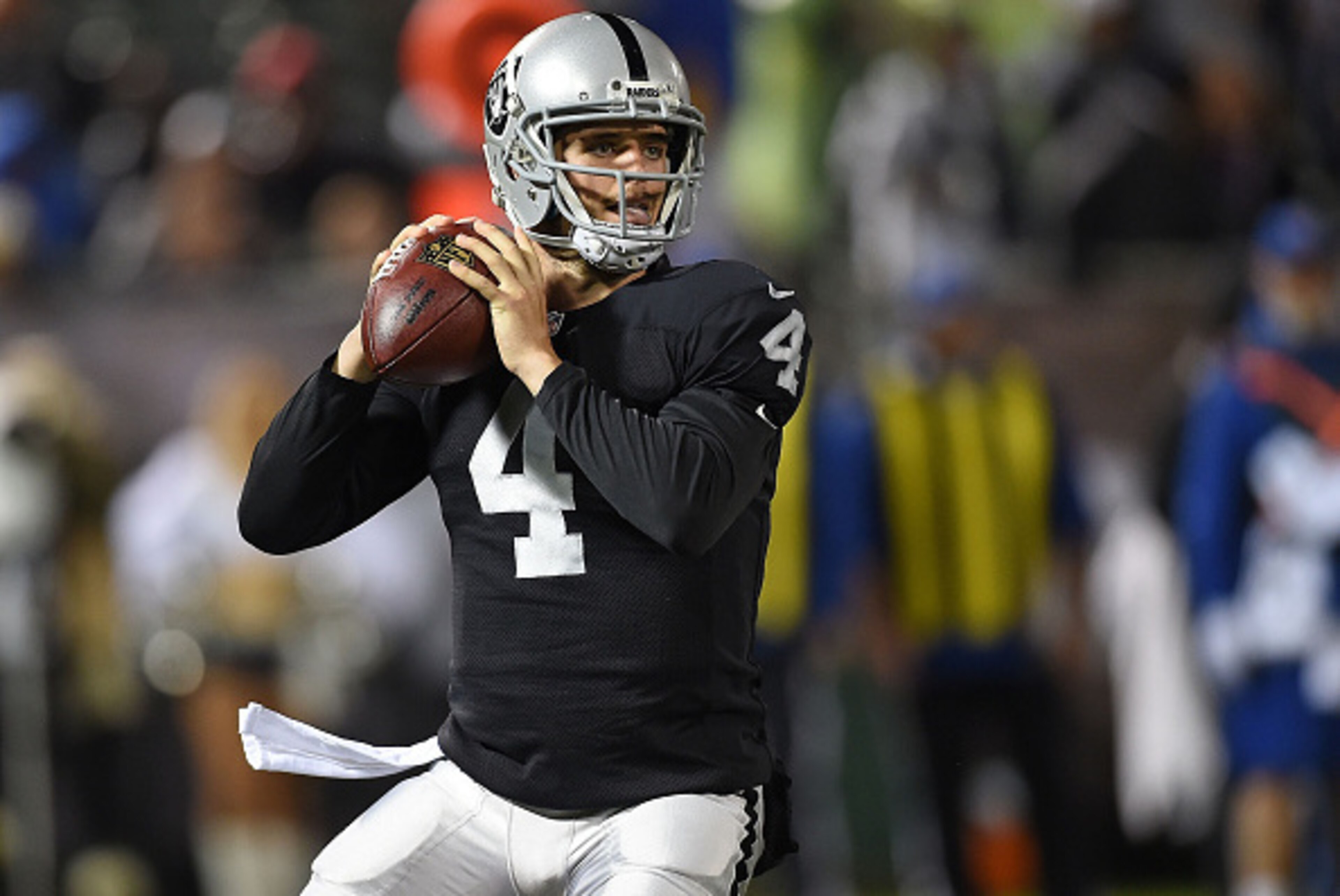 OAKLAND, CA - NOVEMBER 20:  Derek Carr #4 of the Oakland Raiders drops back for a pass during the game against the Kansas City Chiefs at O.co Coliseum on November 20, 2014 in Oakland, California.  (Photo by Thearon W. Henderson/Getty Images)