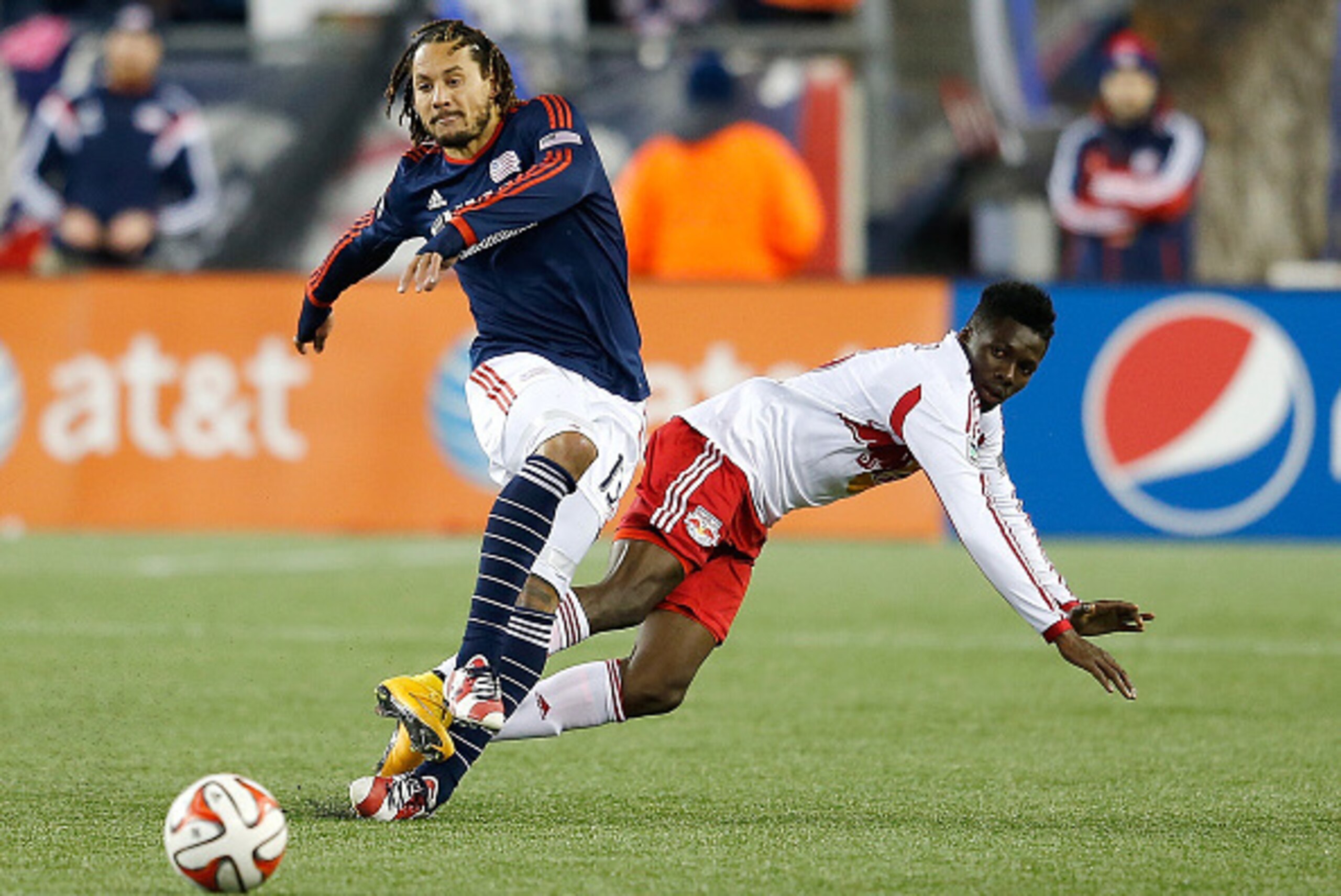 FOXBORO, MA - NOVEMBER 29:  Jermaine Jones #13 of New England Revolution defends against Ambroise Oyongo #3 of New York Red Bulls in the second half during Leg 2 of the MLS Eastern Conference game at Gillette Stadium on November 29, 2014 in Foxboro, Massa