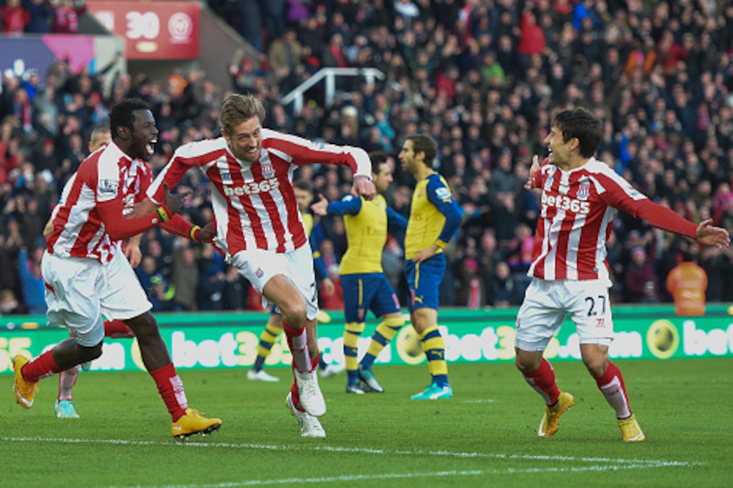 STOKE ON TRENT, ENGLAND - DECEMBER 06: Peter Crouch of Stoke City celebrates scoring the opening goal during the Barclays Premier League match between Stoke City and Arsenal at the Britannia Stadium on December 6, 2014 in Stoke on Trent, England. (Photo b