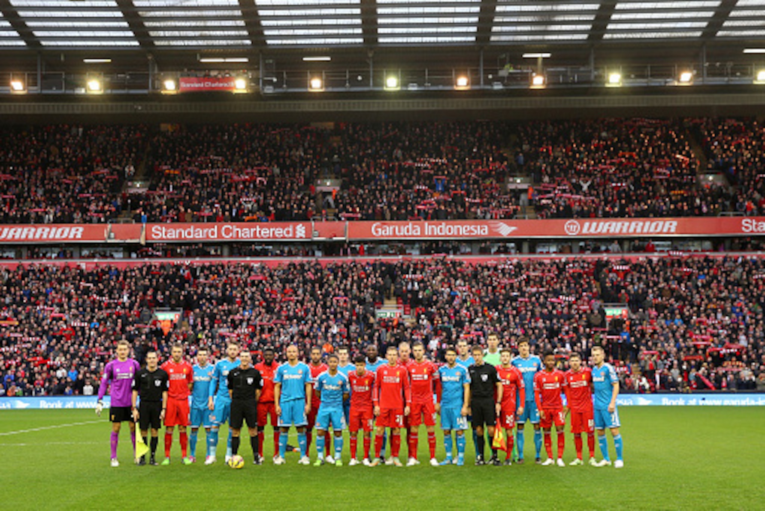 LIVERPOOL, ENGLAND - DECEMBER 06:   The opposing teams pose for the cameras as Football Remembers celebrates the 1914 Christmas Truce prior to kickoff in the Barclays Premier League match between Liverpool and Sunderland at Anfield on December 6, 2014 in 