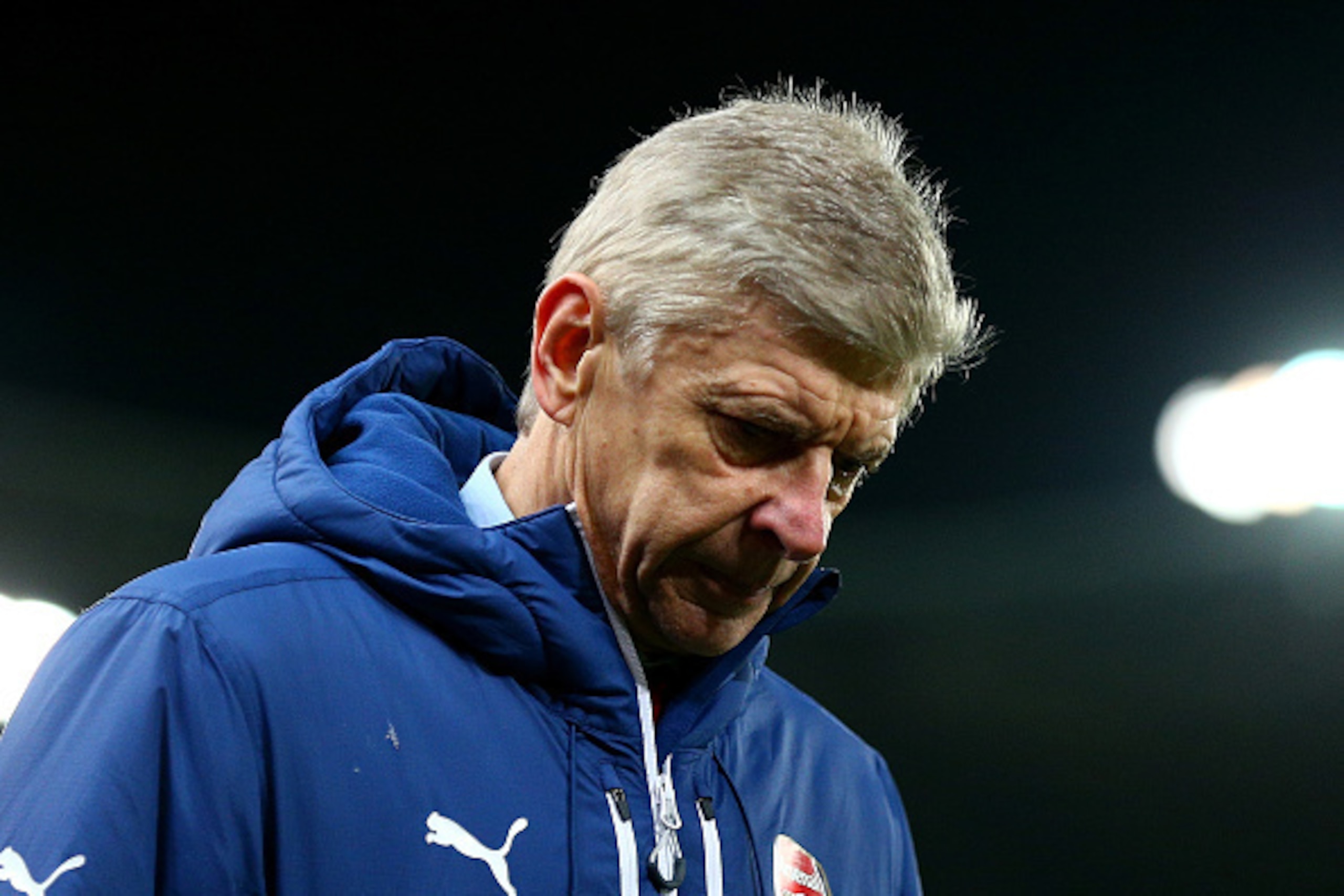 STOKE ON TRENT, ENGLAND - DECEMBER 06:  Arsenal Manager Arsene Wenger walks off at the end of the Barclays Premier League match between Stoke City and Arsenal  at the Britannia Stadium on December 6, 2014 in Stoke on Trent, England.  (Photo by Clive Mason