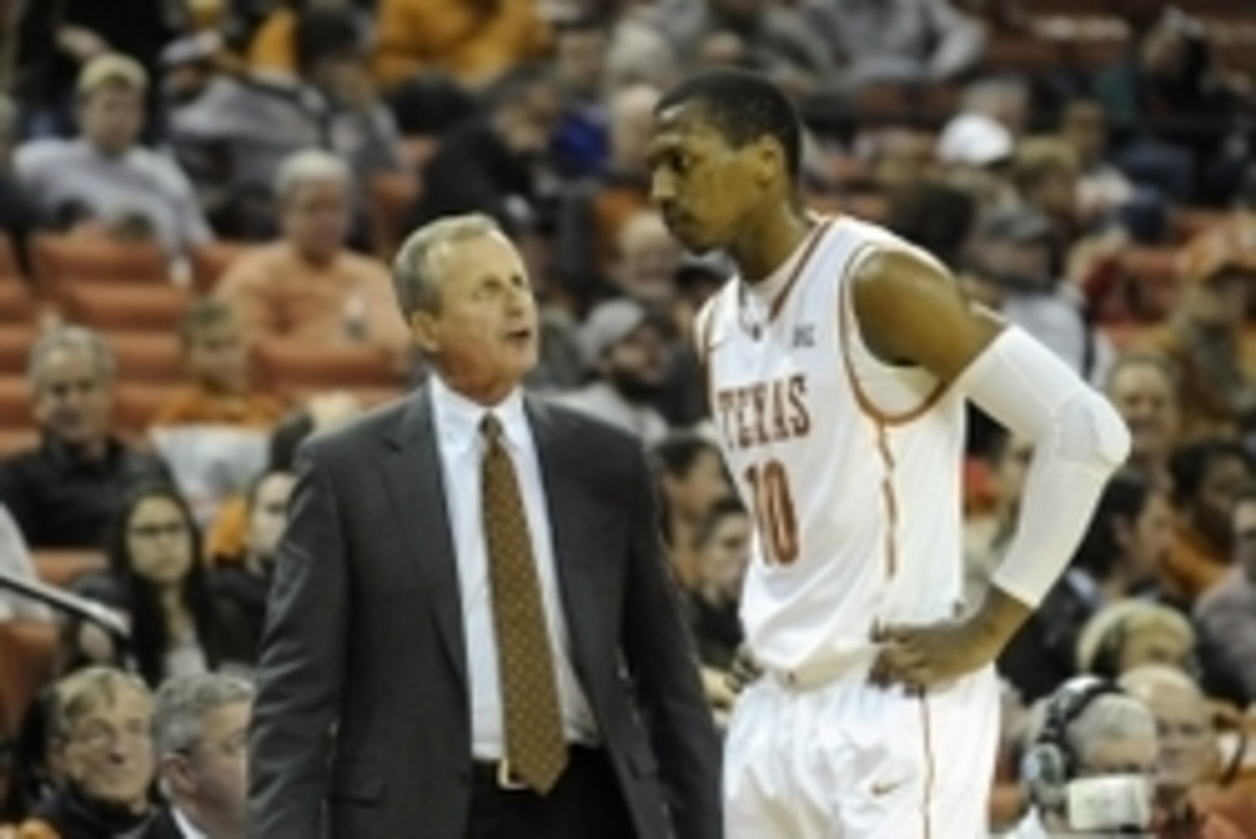 Dec 2, 2014; Austin, TX, USA; Texas Longhorns head coach Rick Barnes (left) talks with forward Jonathan Holmes (10) against the Texas-Arlington Mavericks during the second half at the Frank Erwin Special Events Center. Texas beat Texas-Arlington 63-53. Ma